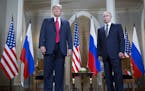 U.S. President Donald Trump, left, and Russian President Vladimir Putin, right, arrive for a one-on-one meeting at the Presidential Palace in Helsinki