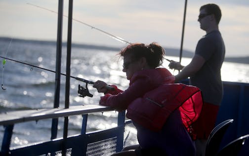 Margo Hill, front, and her son Carl fish for walleyes on the Twin Pines Resort boat near sunset Wednesday, July 29, 2015, during an evening excursion on Lake Mille Lacs.](DAVID JOLES/STARTRIBUNE)djoles@startribune.com The walleye crisis on Mille Lacs sparked a fresh round of fingerpointing, and fewer targets take more blame than the Mille Lacs Band of Ojibwe and the other bands who net fish in the shallows during spawning season. The racial tensions have always been there, but now the Indian ban