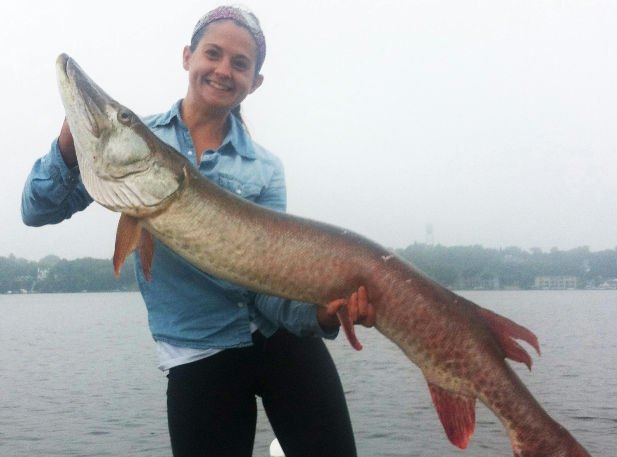 FIRST MUSKIE Kelsey Johnson of Bloomington caught this 52-inch muskie on Lake Waconia recently. It was it was her first time fishing for muskies, and she caught the monster on just her eighth cast.
