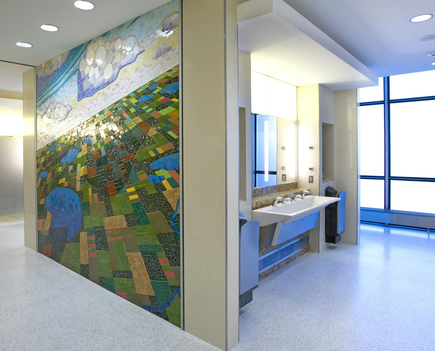 A prototype women's room on Concourse F at Minneapolis-St. Paul International Airport includes a ceramic mosaic by Michael Sweere.