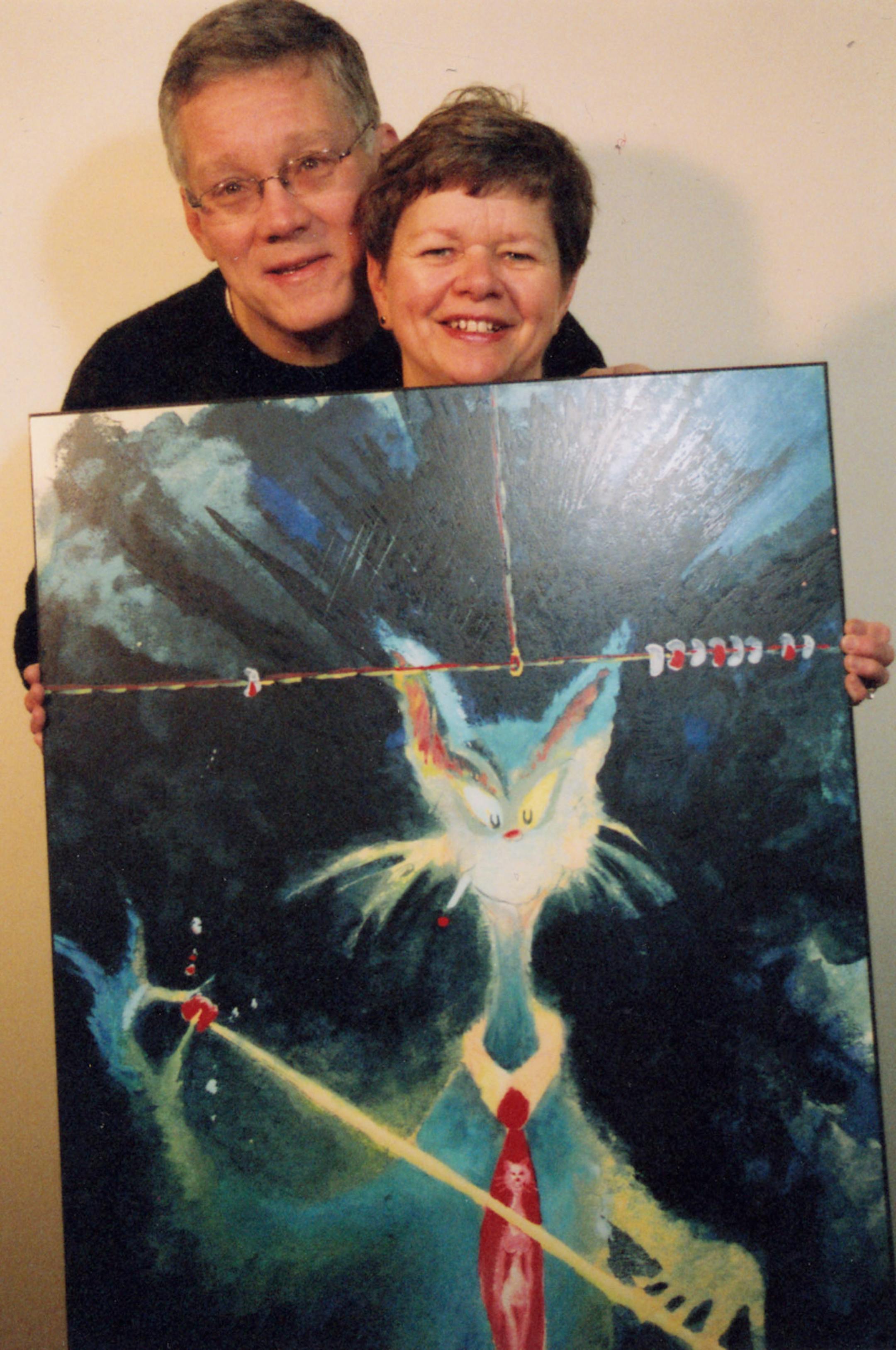 Steve and Jean Danko display a piece of art by the late Theodor Geisel, better known as Dr. Seuss. They are agents for the Seuss art, which has helped their downtown gallery survive.