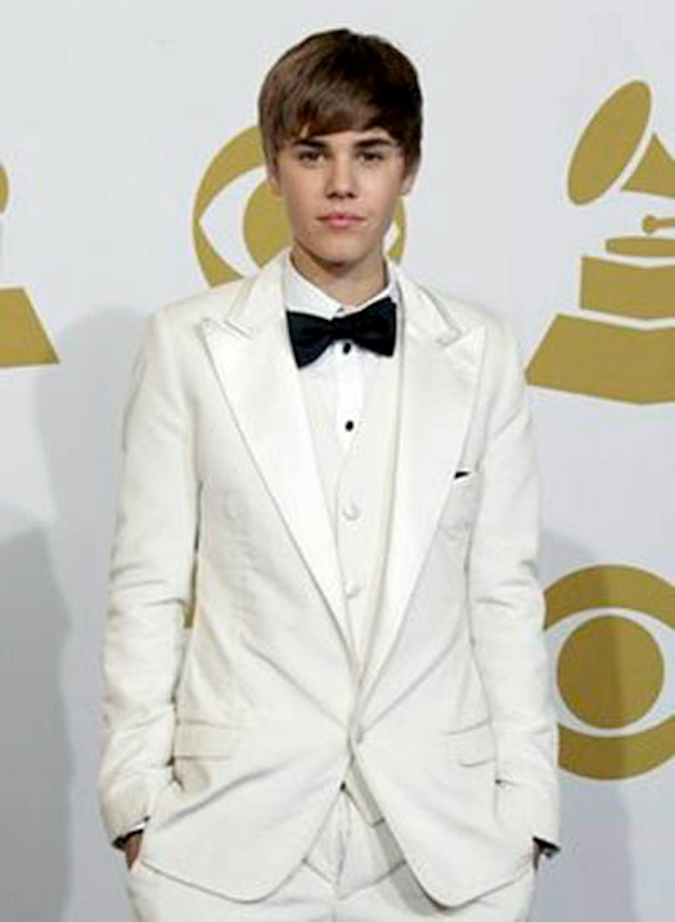 Justin Bieber poses backstage at the 53rd annual Grammy Awards on Sunday, Feb. 13, 2011, in Los Angeles. (AP Photo/Jae C. Hong)
