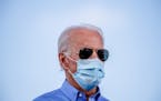FILE -- Joe Biden, the Democratic presidential nominee, addresses a drive-in campaign event at Southeast Career Technical Academy in Las Vegas, on Fri