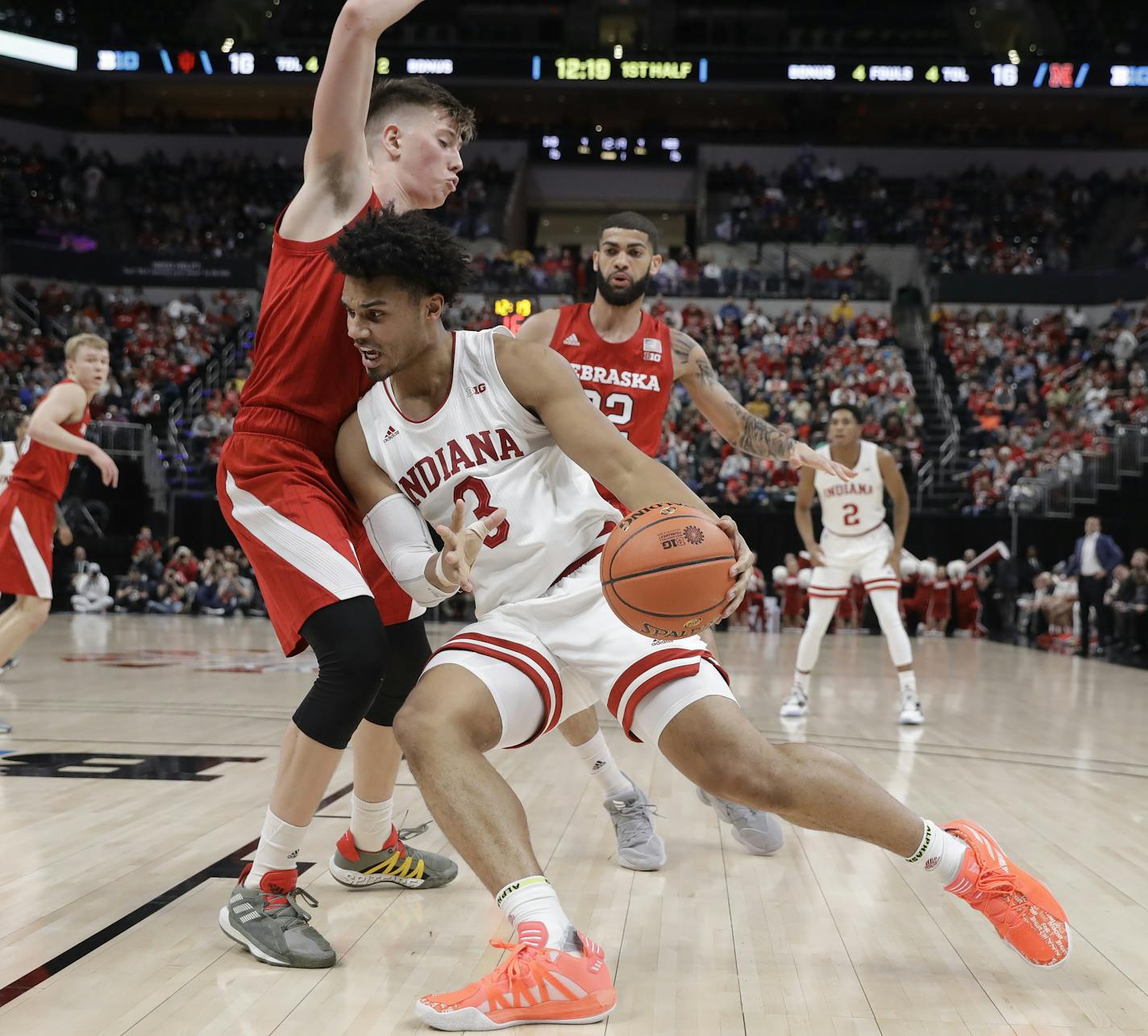 Indiana's Justin Smith (3) goes to the basket against Nebraska's Thorir Thorbjarnarson (34) during the first half of an NCAA college basketball game at the Big Ten Conference tournament, Wednesday, March 11, 2020, in Indianapolis. (AP Photo/Darron Cummings)