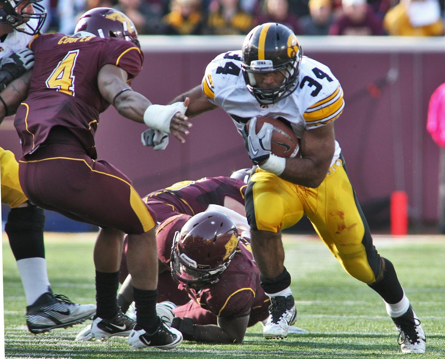 Minnesota Gophers vs. Iowa Hawkeyes football. Iowa running back Marcus Coker picked up over 100 yards rushing in the first half.