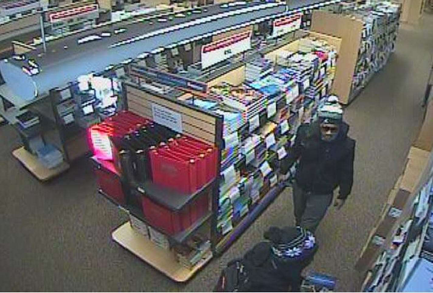 Police released video surveillance photos of suspects in a series of thefts from the St. Cloud State University campus bookstore.