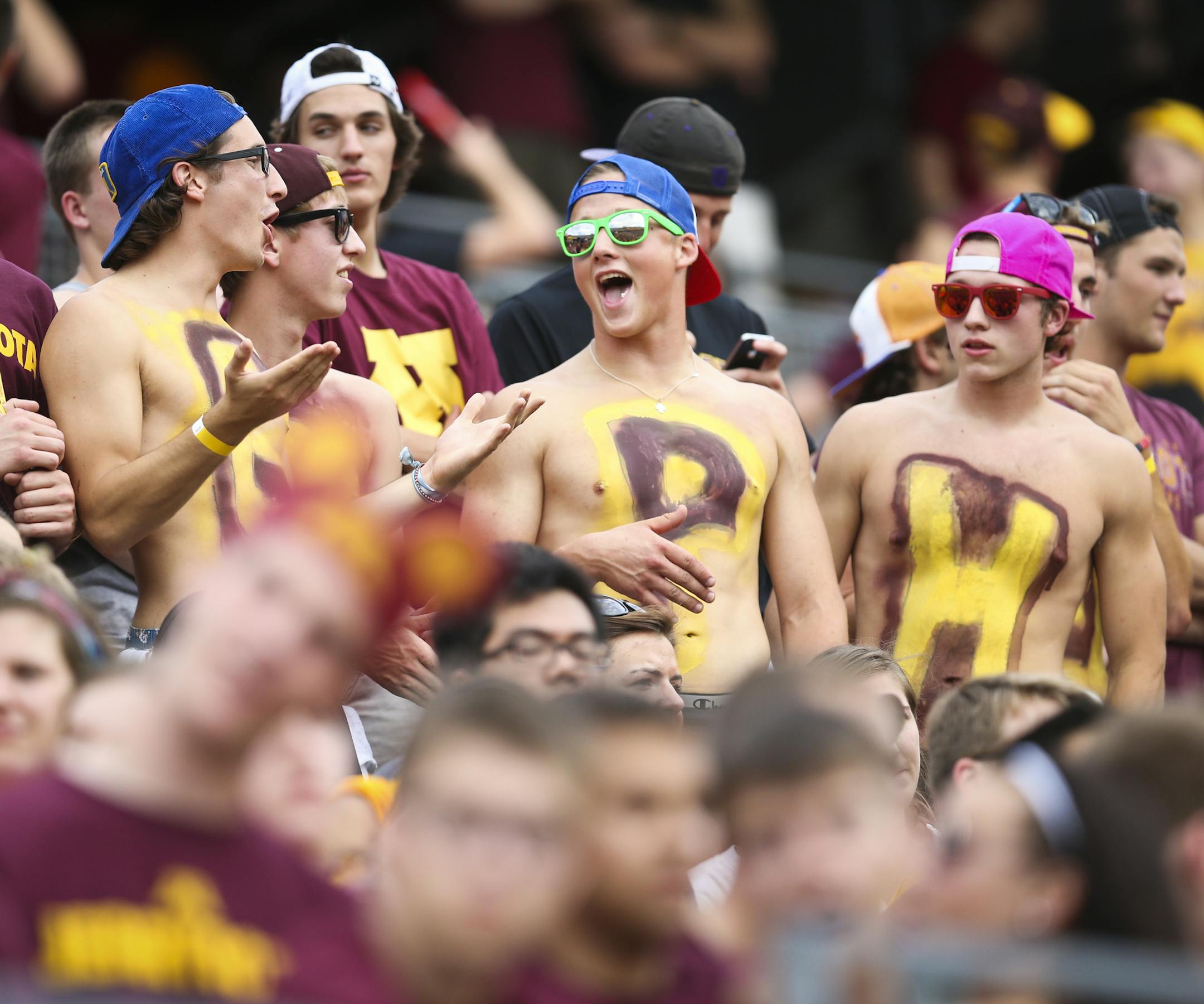 Fans with the letters spelling "Gopher" on their chests, cheered before the Minnesota Gophers vs. UNLV in the season opener at TCF Bank Stadium at the University of Minnesota in Minneapolis, Minn. ] (RENEE JONES SCHNEIDER • reneejones@startribune.com)
