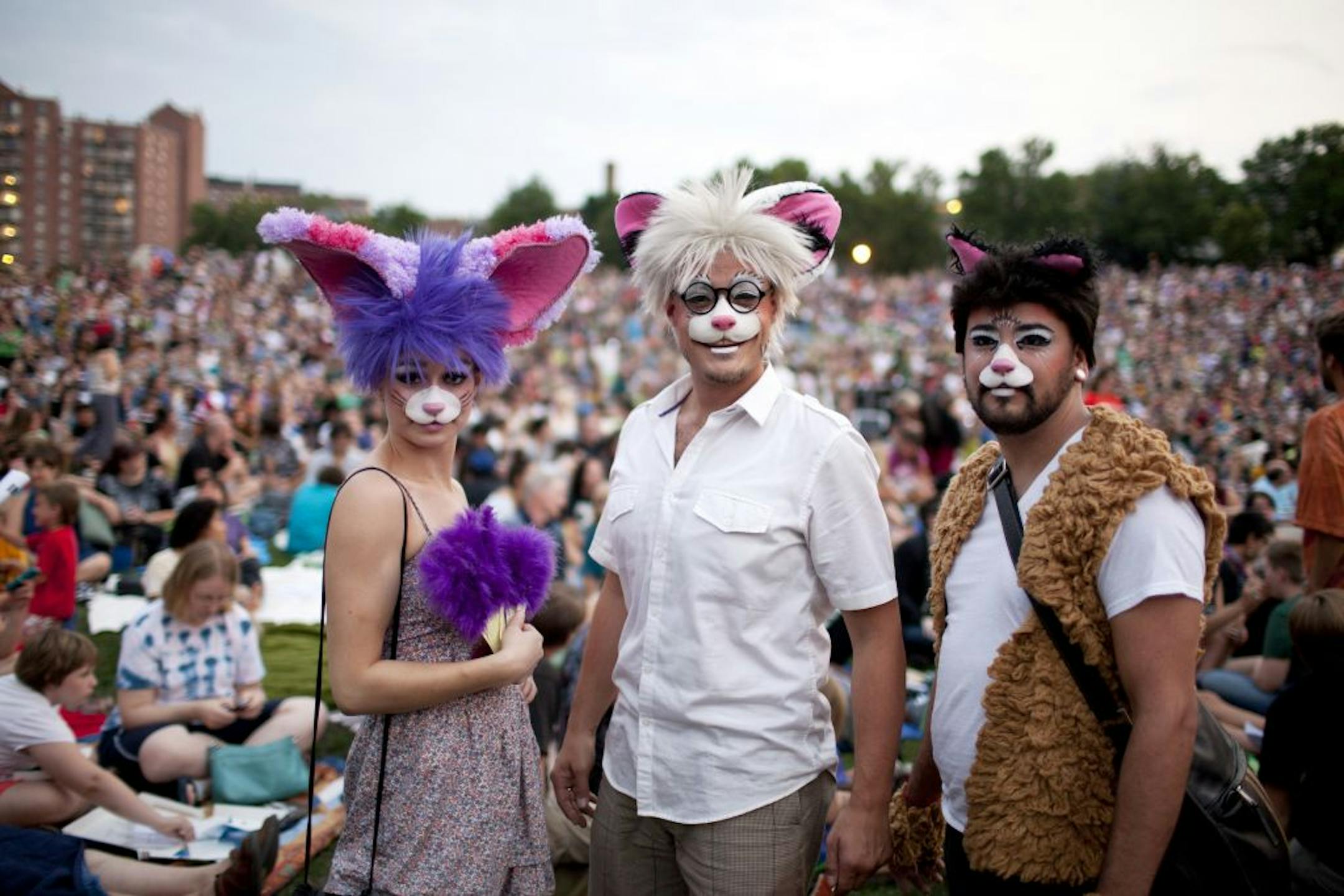 From left: Hilary Hubanks, Joseph McGreevy and Jerry Woulf show off their outfits at the Walker Art Center's first Internet Cat Video Film Festival, in Minneapolis, Aug. 30, 2012. The festival attracted an estimated 10,000 people, easily double what organizers expected.