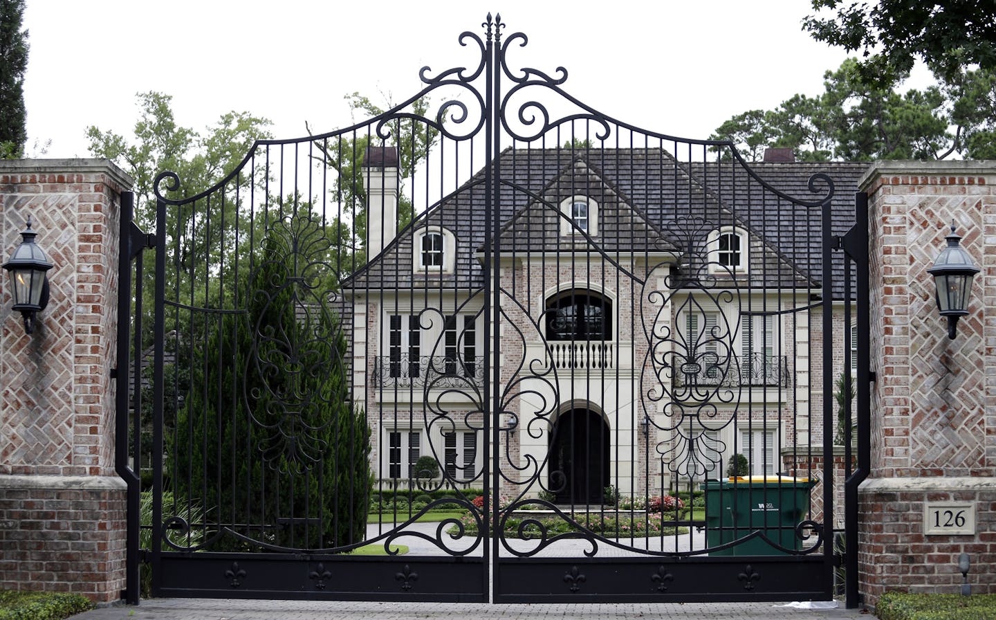 The Montgomery County home of running back Adrian Peterson is shown Saturday, Sept. 13, 2014, in Spring, Texas, north of Houston. Peterson was indicted in Texas for using a branch to spank one of his sons. He turned himself in early Saturday at a jail in Montgomery County and was processed and released according to a jail records official. (AP Photo/David J. Phillip) ORG XMIT: MIN2014091313531304