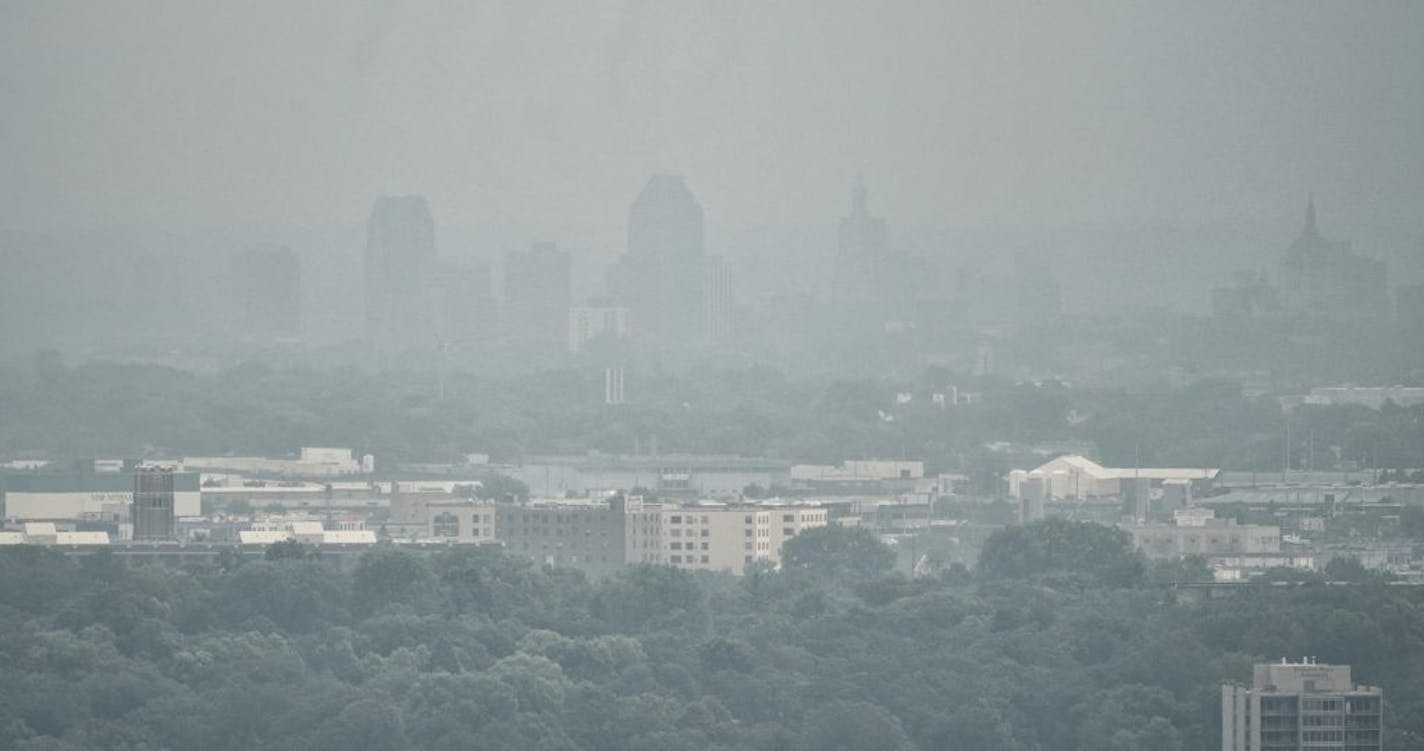 Hazy smoke with a faint campfire smell, over Minnesota is expected to remain in our area through Wednesday as the jet stream carries smoke from Canadian wildfires our way. Hazy horizons are seen in all four directions from the observation deck of the Foshay Tower in downtown Minneapolis. This is looking east toward St. Paul.