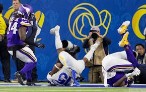 Demarcus Robinson of the Rams got between Vikings defenders to catch a touchdown pass on Thursday night in Los Angeles.