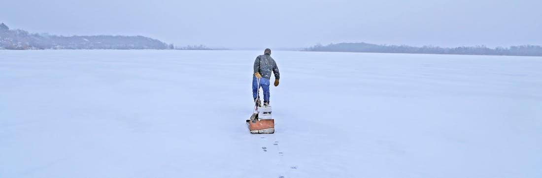 Ice fishing sled full of fishing gear