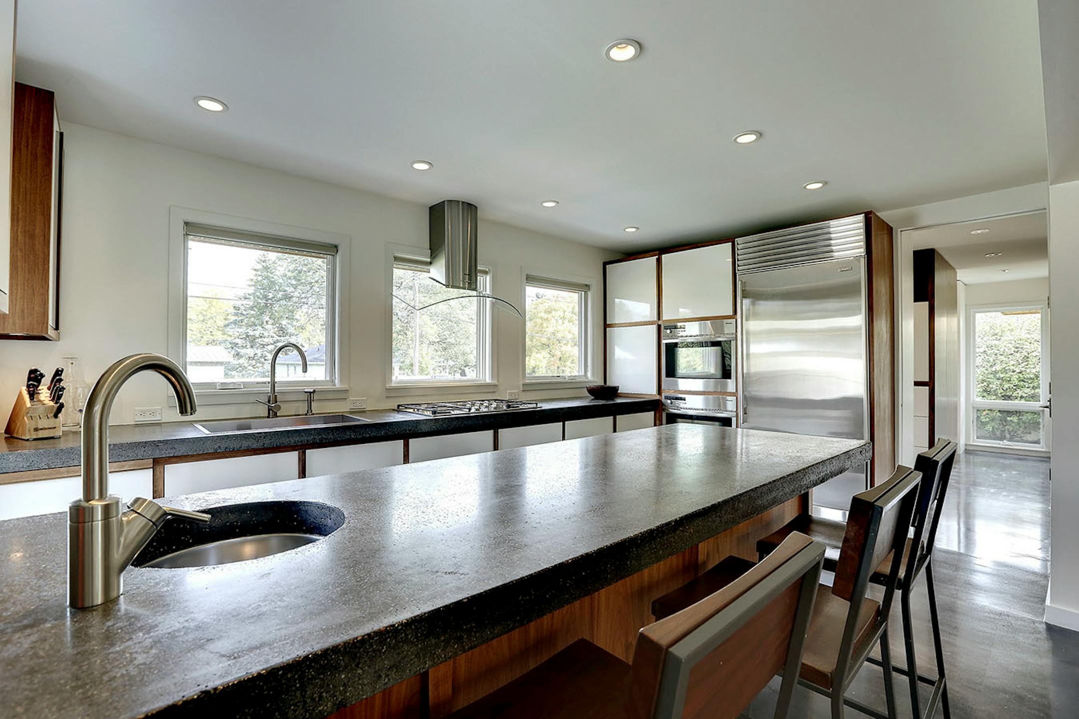 A previous owner's remodeled kitchen with a concrete island top set the stage for the next phase of updates.