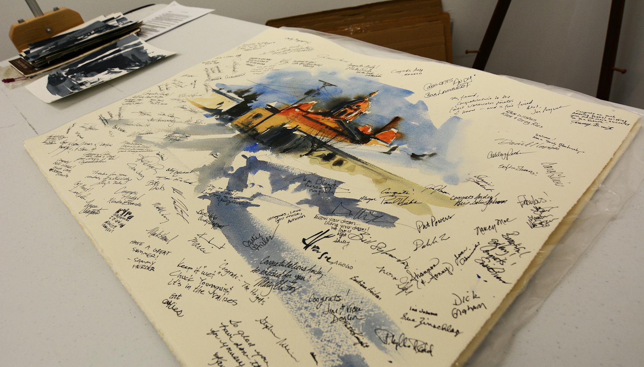 Andy Evansen did this quick sketch of the Hastings City Hall, and guests signed it during the gallery's opening. Photo by Liz Rolfsmeier, Special to the Star Tribune