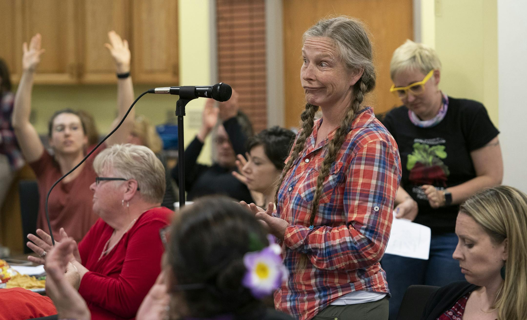 People surrounding teacher Kristen Melby showed their support after she asked Superintendent Ed Graff if he could make a commitment to not hold to the August deadline of the district's new strategic plan and have some dialogs about what is best for the district during a meeting at the Minneapolis Federation of Teachers 59 headquarters in Minneapolis, Minn., on Wednesday, May 15, 2019. ] RENEE JONES SCHNEIDER ¥ renee.jones@startribune.com