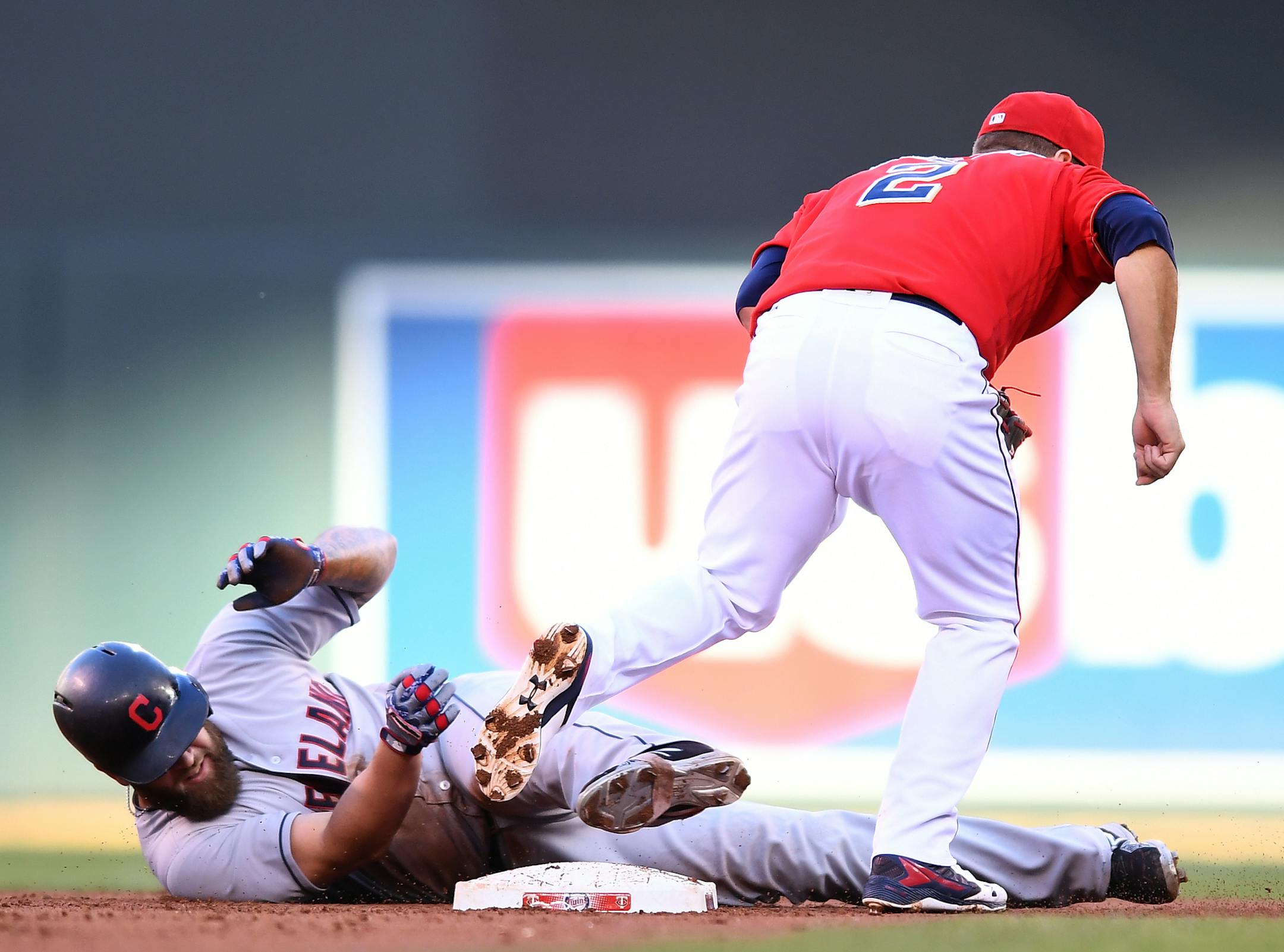 Cleveland Indians first baseman Mike Napoli (26) slid past first after being tagged out by Minnesota Twins second baseman Brian Dozier (2) after nearly hitting a double in the top of the second inning. ] (AARON LAVINSKY/STAR TRIBUNE) aaron.lavinsky@startribune.com The Minnesota Twins played the Cleveland Indians on Friday, July 15, 2016 at Target Field in Minneapolis, Minn.