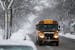 A school bus drove north on Johnson Street North East amid a flurry of snowflakes on Wednesday morning.