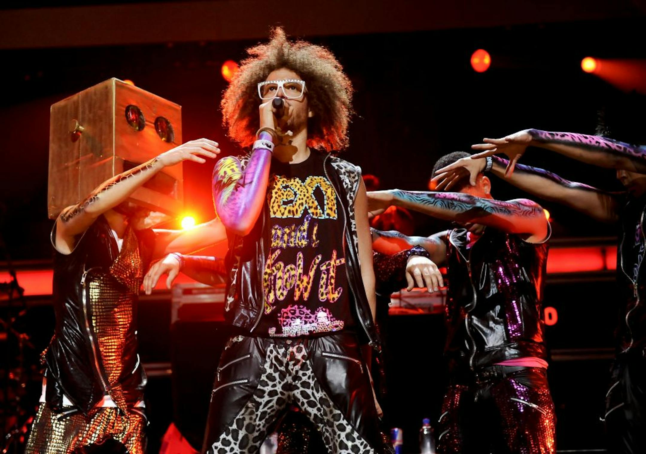 FILE - In this Dec. 9, 2011 file photo, singer RedFoo, center, and LMFAO perform at Z100's Jingle Ball concert at Madison Square Garden in New York. When LMFAO released its sophomore album, "Sorry for Party Rocking," it only sold 27,000 units in its first week. But almost a year later, the album is approaching platinum status thanks to the monster hits "Party Rock Anthem" and "Sexy and I Know It," and fans connecting more with the wild, party-boy vibe of the duo.