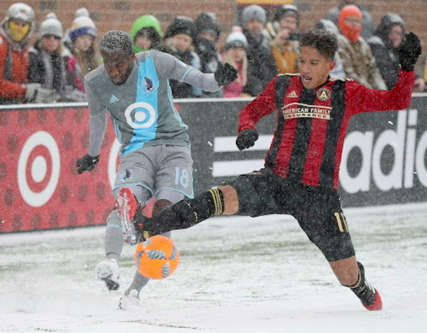 Minnesota United midfielder Kevin Molino, left, battled Atlanta United midfielder Yamil Asad during the March 12 home opener.