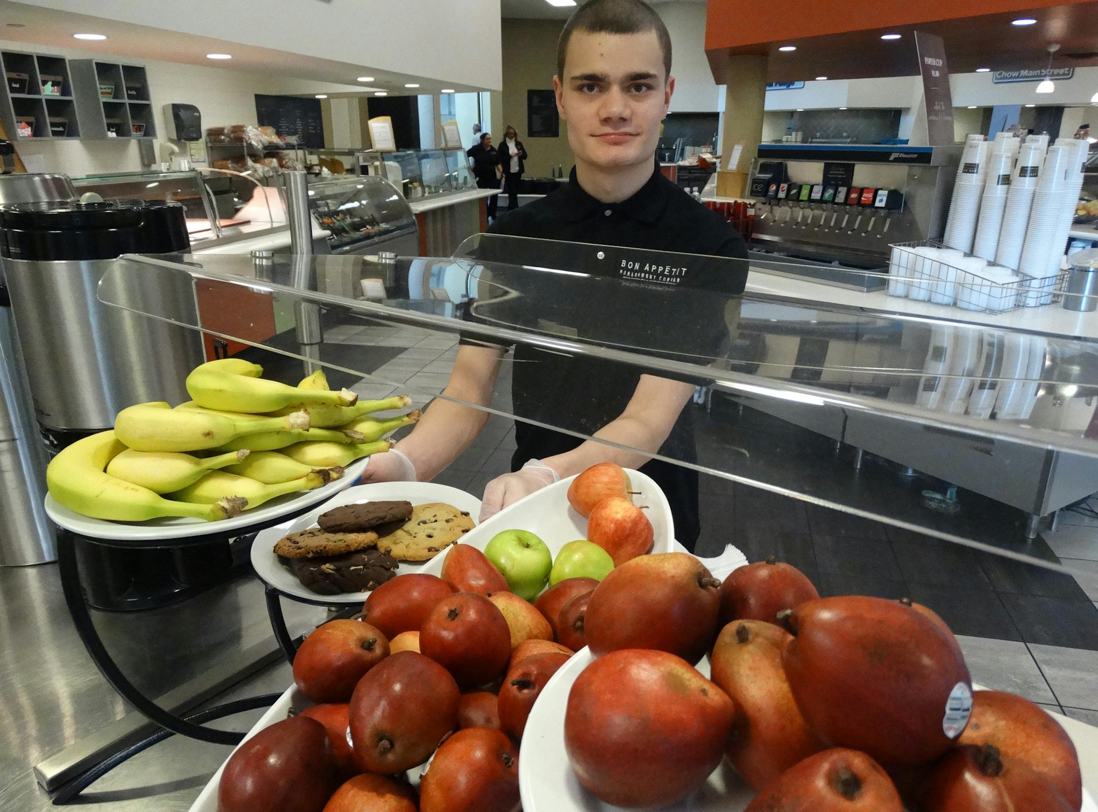 Sam Leikind, a culinary student at Minnesota Life College, set out food at the cafe at Best Buy headquarters in Richfield.