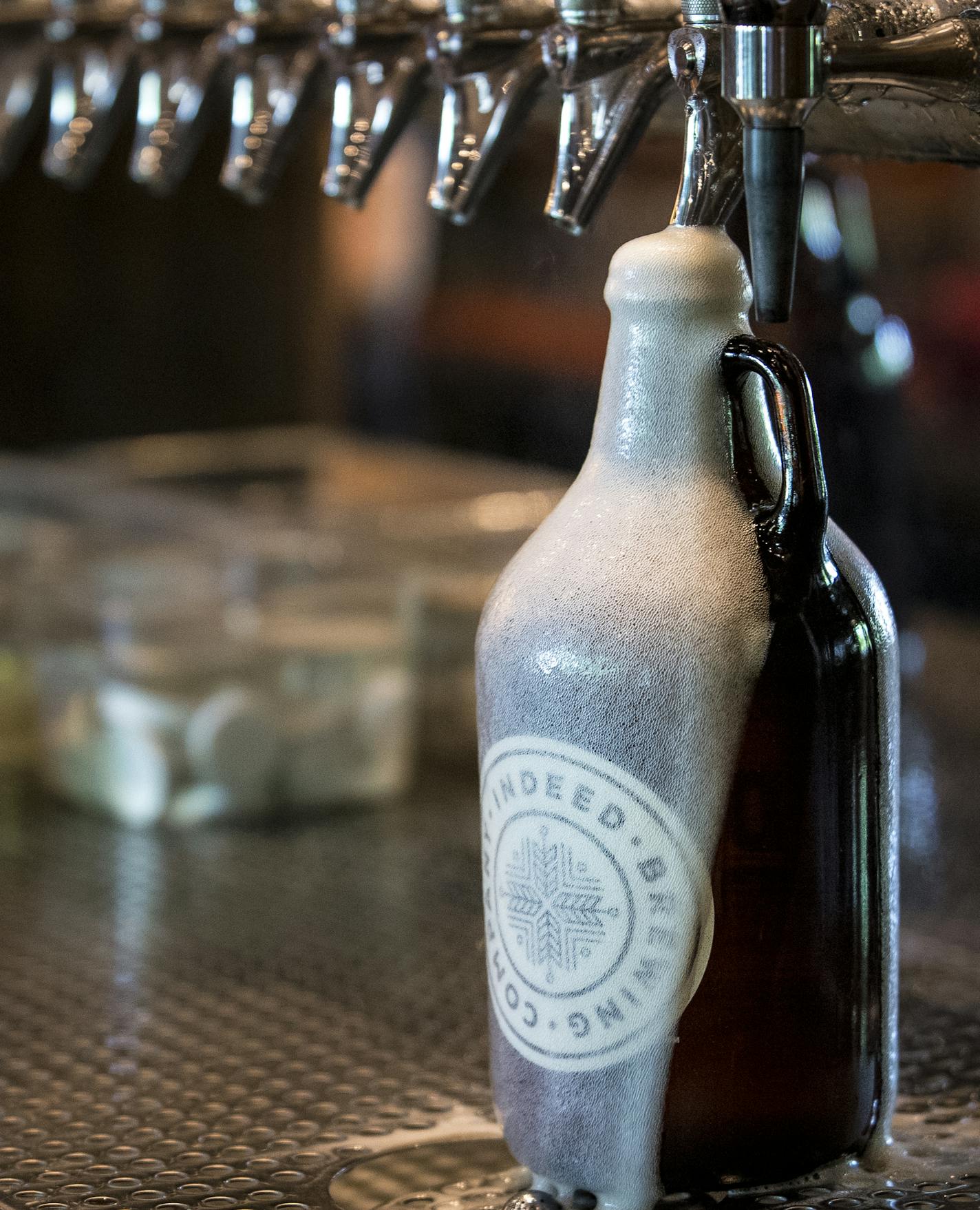 A growler overflowed while being filled at Indeed Brewery in northeast Minneapolis in 2016.