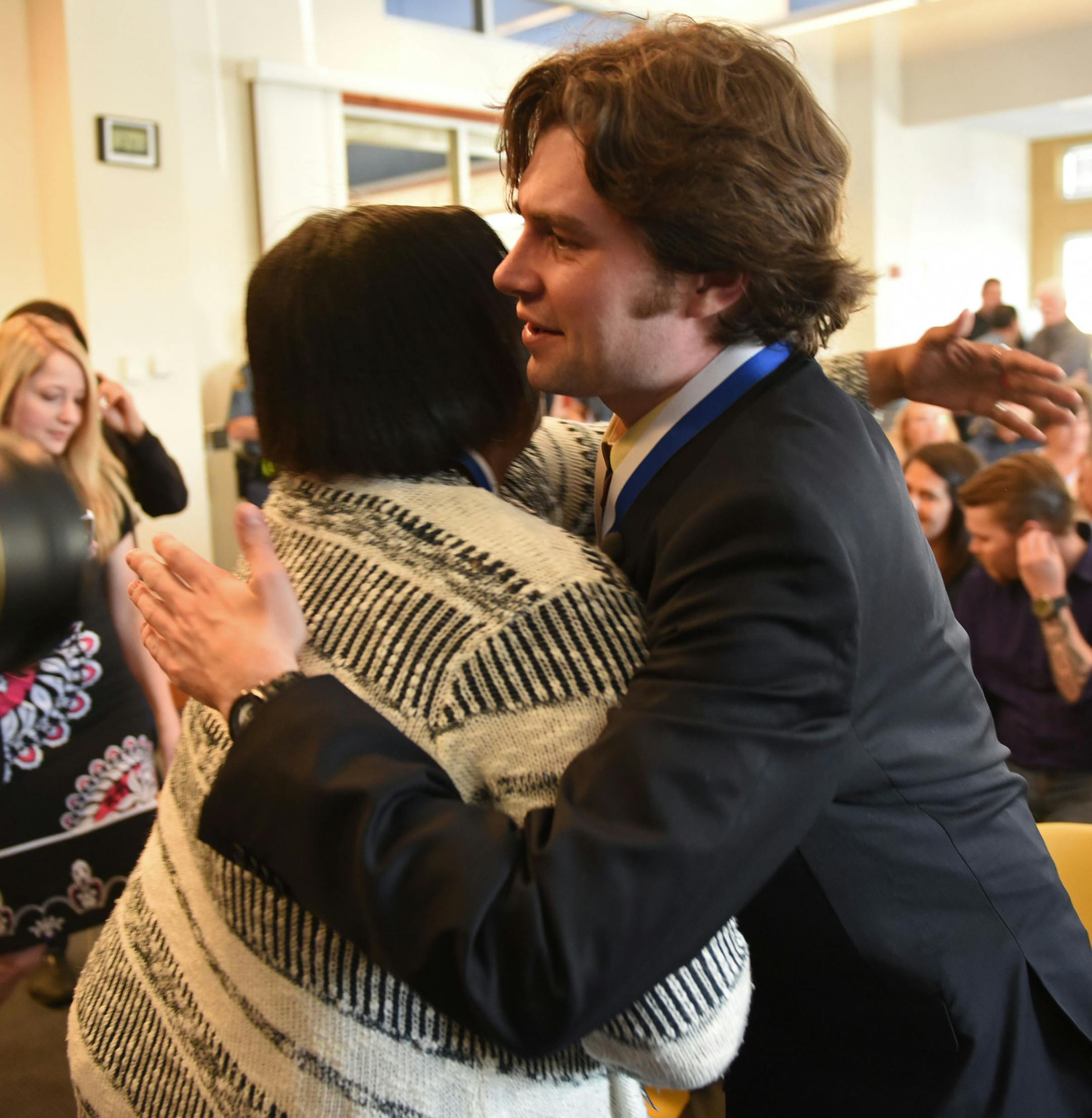 Ray Widstrand receives the chief's award for valor at the Saint Paul Police Western District building in Saint Paul on Friday, April 22, 2016.. Mr. Widstrand was nearly beaten to death in 2013 when he tried to help a woman who had fallen during a street brawl. Tanikqwa Givens, who threw herself over Ray Widstrand's body during the attack, was also honored. ] MARK KEGANS, Special to the Star-Tribune, Saint Paul, MN, April 22, 2016