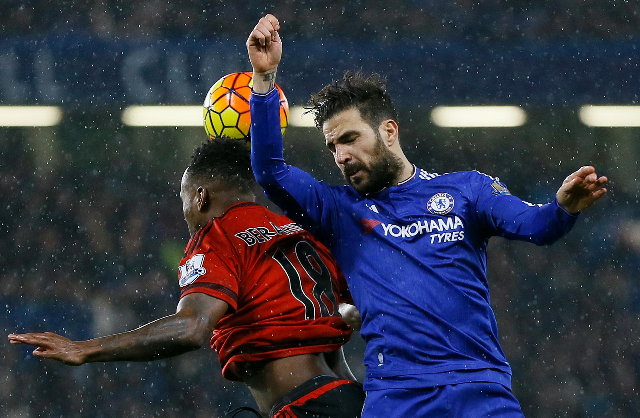 Chelsea's Cesc Fabregas, right, vies for the ball with West Bromich Albion's Saido Berahino during the English Premier League soccer match between Chelsea and West Bromwich Albion at Stamford Bridge stadium in London, Wednesday, Jan. 13, 2016. (AP Photo/Kirsty Wigglesworth)