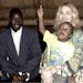 Madonna holds her adopted son David as they meet with the boy's biological father, Yohane Banda, left, at a lodge where the pop star is staying in Mal
