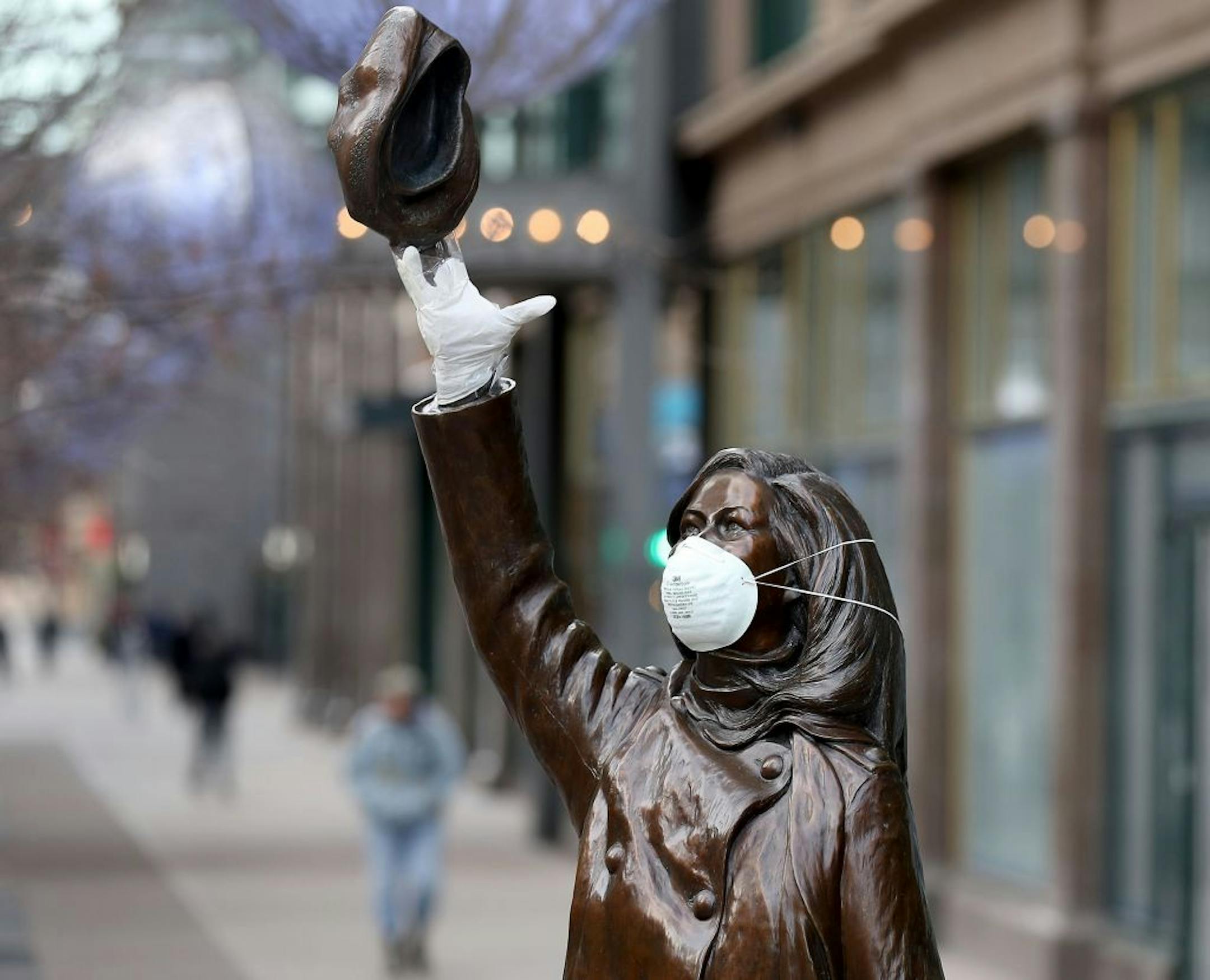 The Mary Tyler Moore statue on Nicollet Mall got a mask and rubber glove, perhaps for levity in the face of the Coronavirus, and seen Wednesday, April 1, 2020, in downtown Minneapolis, MN.