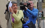 May 30, 2012: Lori Christensen tried to hide from the news media after her appearance in Ramsey County district court.