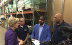 Sen. Elizabeth Warren spoke with Better Futures Minnesota President Thomas Adams and other staff at the nonprofit's Minneapolis warehouse Tuesday, whe