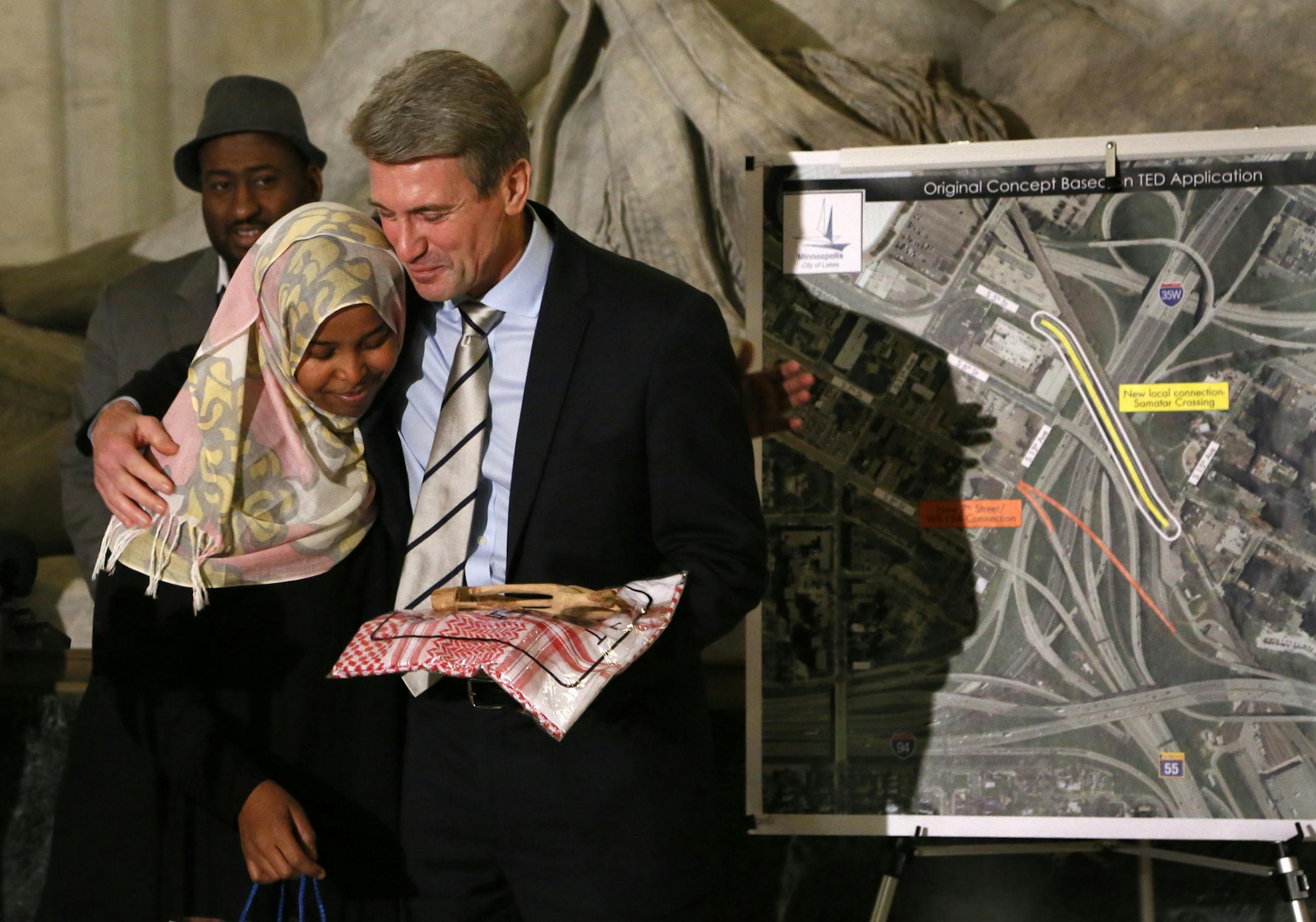 Outgoing Minneapolis Mayor R.T. Rybak held his final news conference Monday afternoon, announcing a new 7th street entrance into downtown, replacing 5th street with a new pedestrian gateway to the city from the Cedar Riverside neighborhood. Named Samatar Crossing in memory of Hussein Samatar, the first Somali-American to hold public office in Minnesota. Here, Mayor Rybak hugs Samatar's widow Ubah Jama after the announcement. ] BRIAN PETERSON &#x201a;&#xc4;&#xa2; brianp@startribune.com Minneapoli