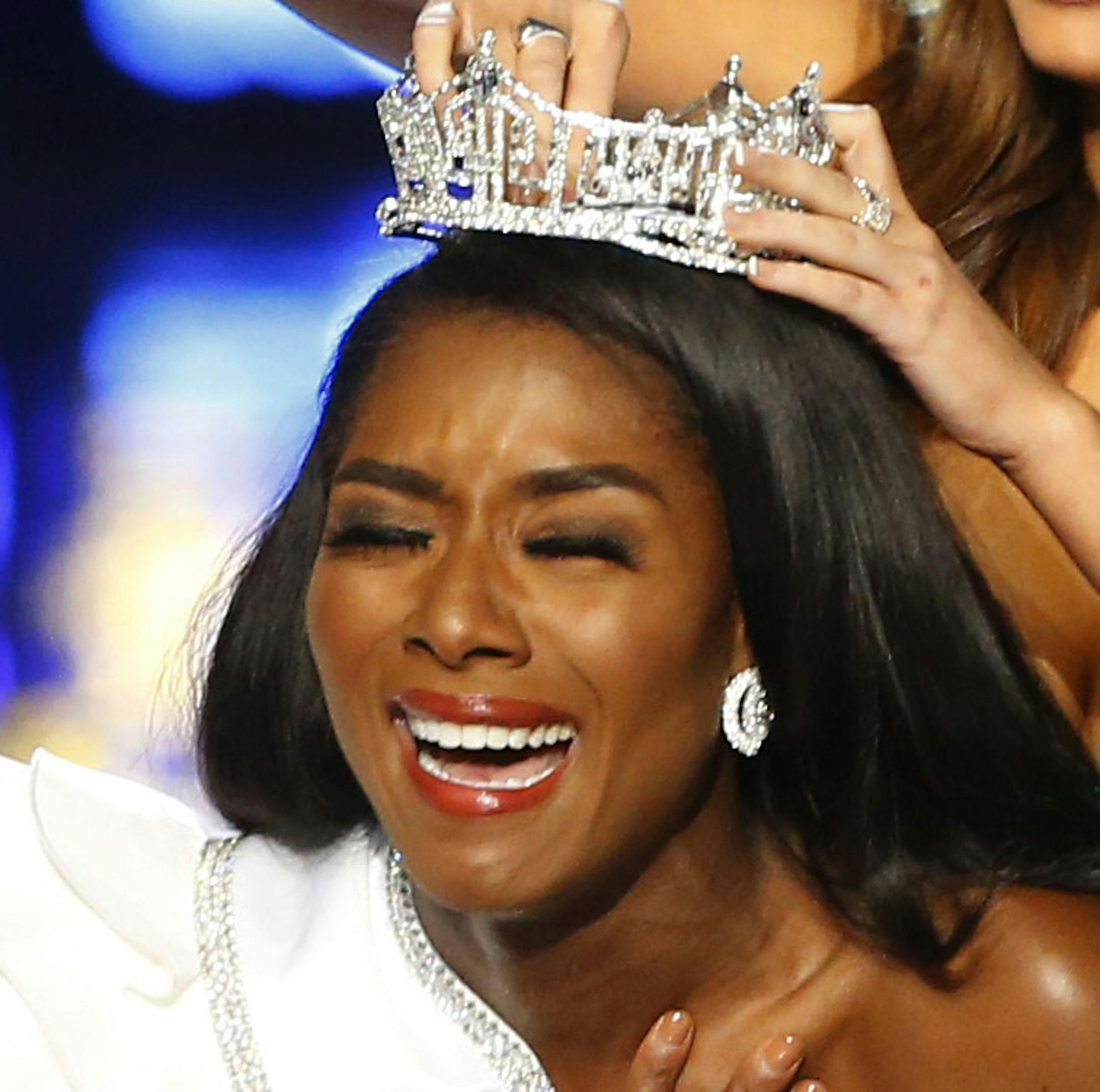 Miss New York Nia Franklin reacts after being named Miss America 2019, as she is crowned by last year's winner Cara Mund, Sunday, Sept. 9, 2018, in Atlantic City, N.J. (AP Photo/Noah K. Murray)