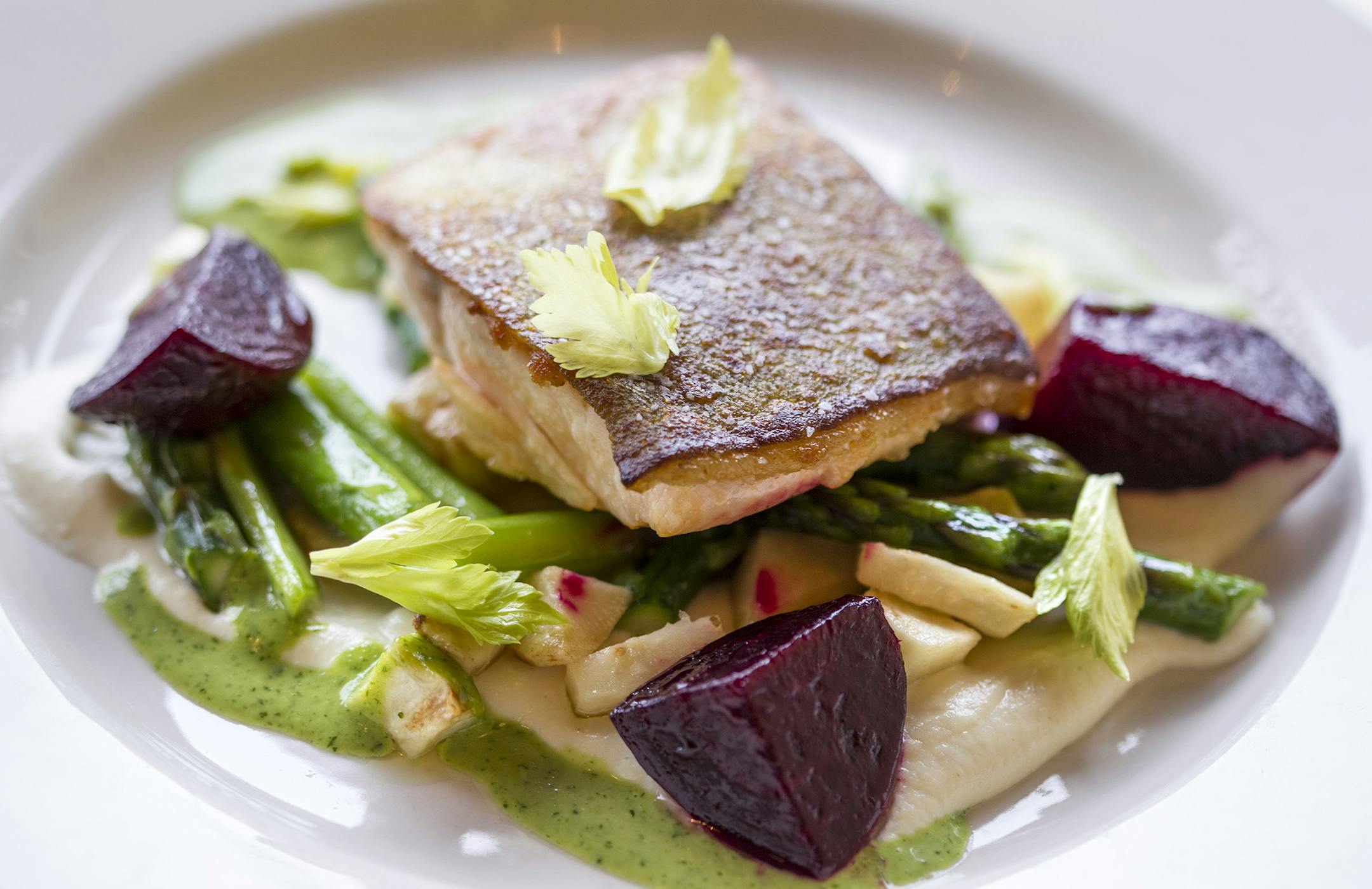 Pan-seared Arctic Char with dill vinaigrette, roasted beets, celery root and asparagus at Lucia's restaurant in Minneapolis March 7, 2014. (Courtney Perry/Special to the Star Tribune)