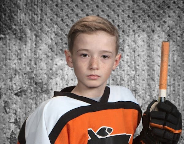 Marshall "Turbo" Bader, 9, of Boy River, Minn., died in a farm accident. He was an avid hockey player and he's being honored with hockey sticks displa