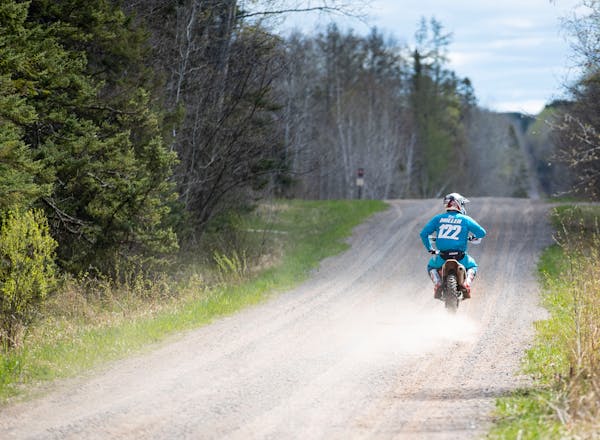 Baylor Litsey rode his dirt bike on a County Road near the Nemadji Forest on Friday Sunday, May 7, 2021. ]