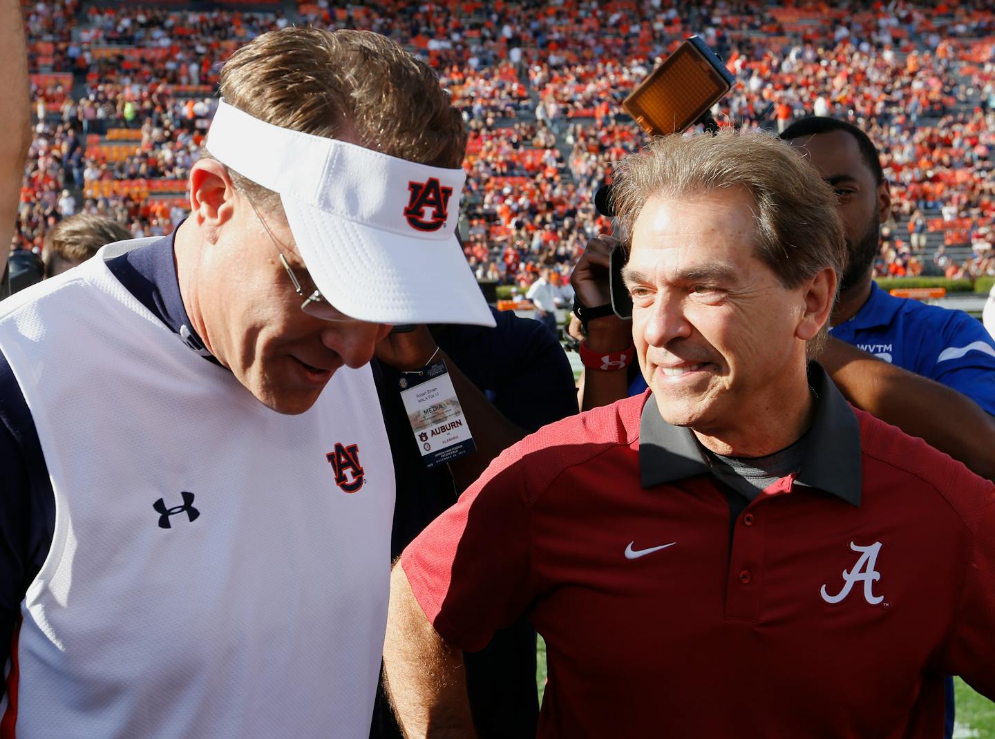 FILE - In this Nov. 28, 2015, file photo, Alabama head coach Nick Saban, right, and Auburn head coach Gus Malzahn meet before an NCAA college football game in Auburn, Ala. The top-ranked Crimson Tide and No. 16 Auburn meet Saturday in The Iron Bowl. (AP Photo/Butch Dill, File)