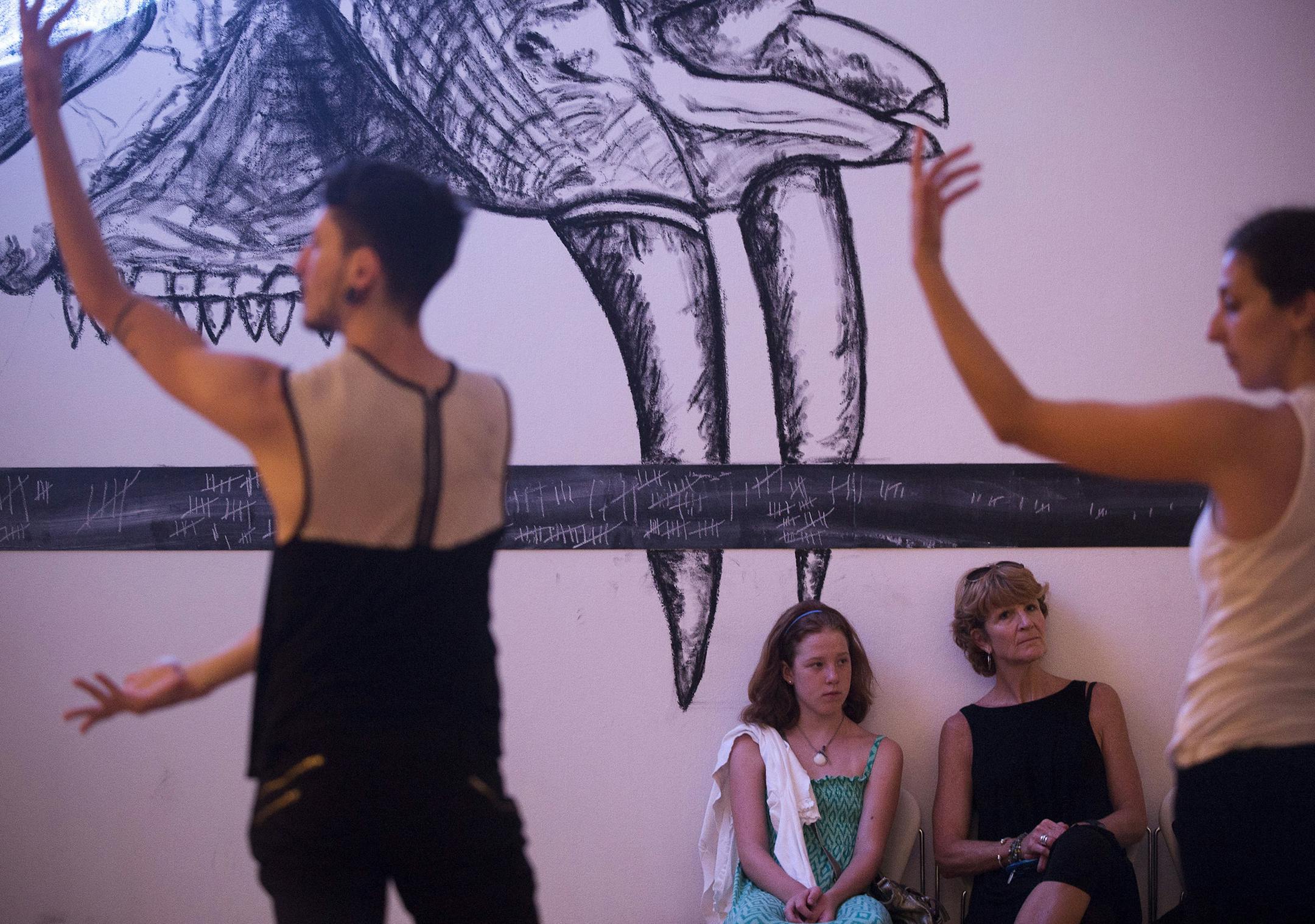Sierra Hermansen, 12 and her mother Holly Hermansen, both of Minneapolis, watched dancers perform during Morgan Thorson's "Still Life" as part of the "Local Time" exhibition at The Frederick R Weisman Art Museum in Minneapolis Minn. on Friday August 14, 2015. ] RACHEL WOOLF &#xb7; rachel.woolf@startribune.com "Still Life" is co-sponsored by The New England Foundation for the Arts and the National Performance Network. The performance is in five-hour marathons with folding chairs surrounding the d