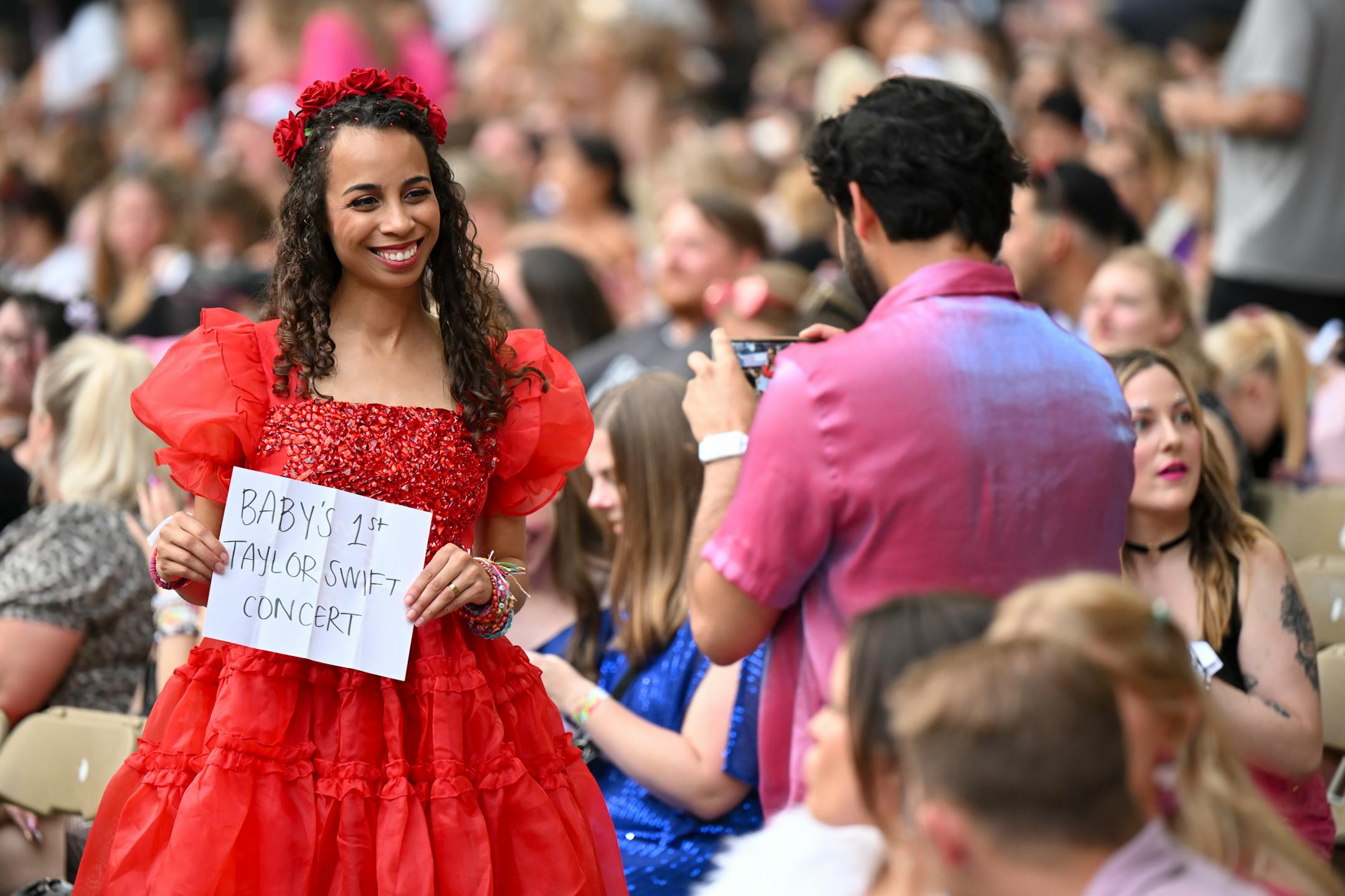 Taylor Swift fans take photos before Swift's performance Friday, June 23, 2023, at US Bank Stadium in Minneapolis, Minn.