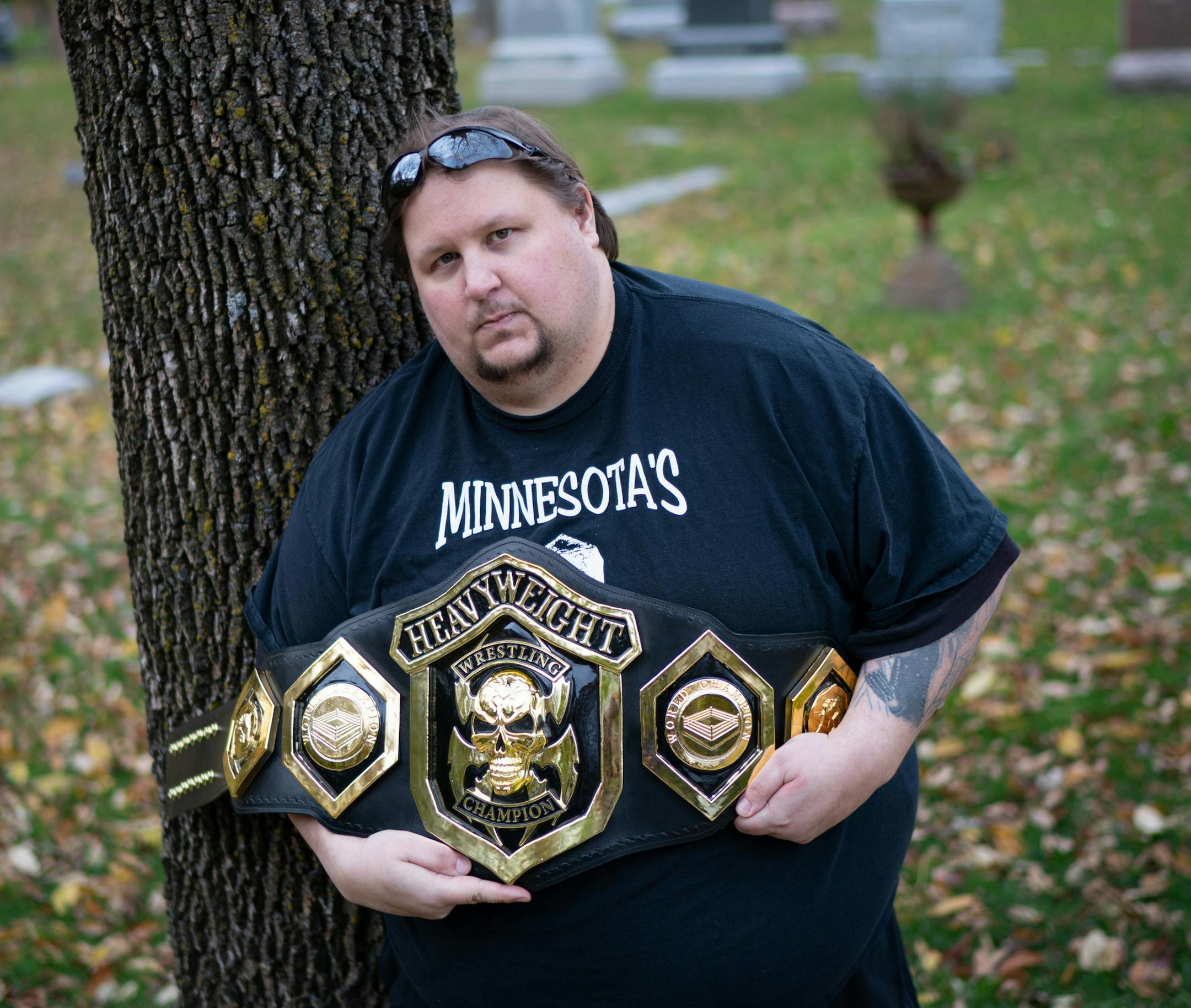 Paranormal Investigator and Pro Wrestler Bryan Dorn held the trophy belt he won earlier this month in Chicago at the Paranormal Pro Wrestling event, part of the Chicago Ghost Con Paranormal Convention. ] GLEN STUBBE • glen.stubbe@startribune.com Wednesday, October 23, 2019 The paths of glory lead but to the grave. But also to the Facebook page of Bryan "Ian Xavier" Dorn, a paranormal investigator, professional wrestler and documenter of the final resting places of some of Minnesota's most