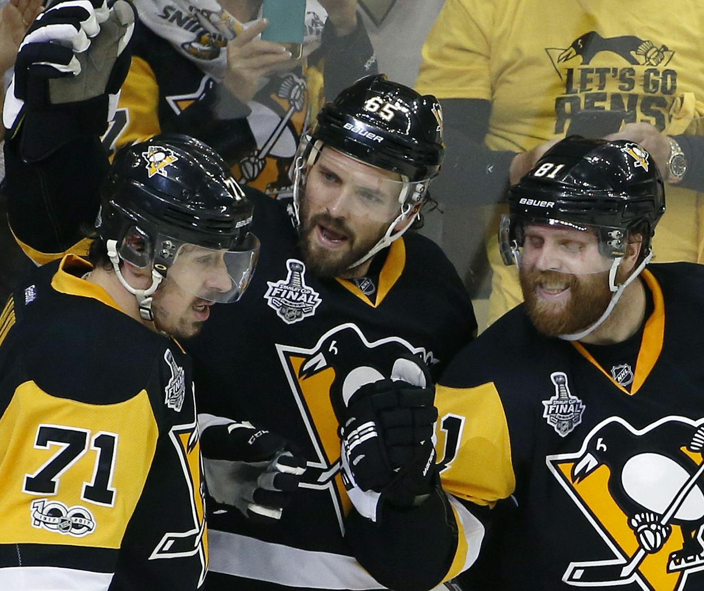 Pittsburgh Penguins' Ron Hainsey, center, celebrates his goal against the Nashville Predators with Evgeni Malkin, left, and Phil Kessel, right, during the second period in Game 5 of the NHL hockey Stanley Cup Final, Thursday, June 8, 2017, in Pittsburgh. (AP Photo/Gene J. Puskar)