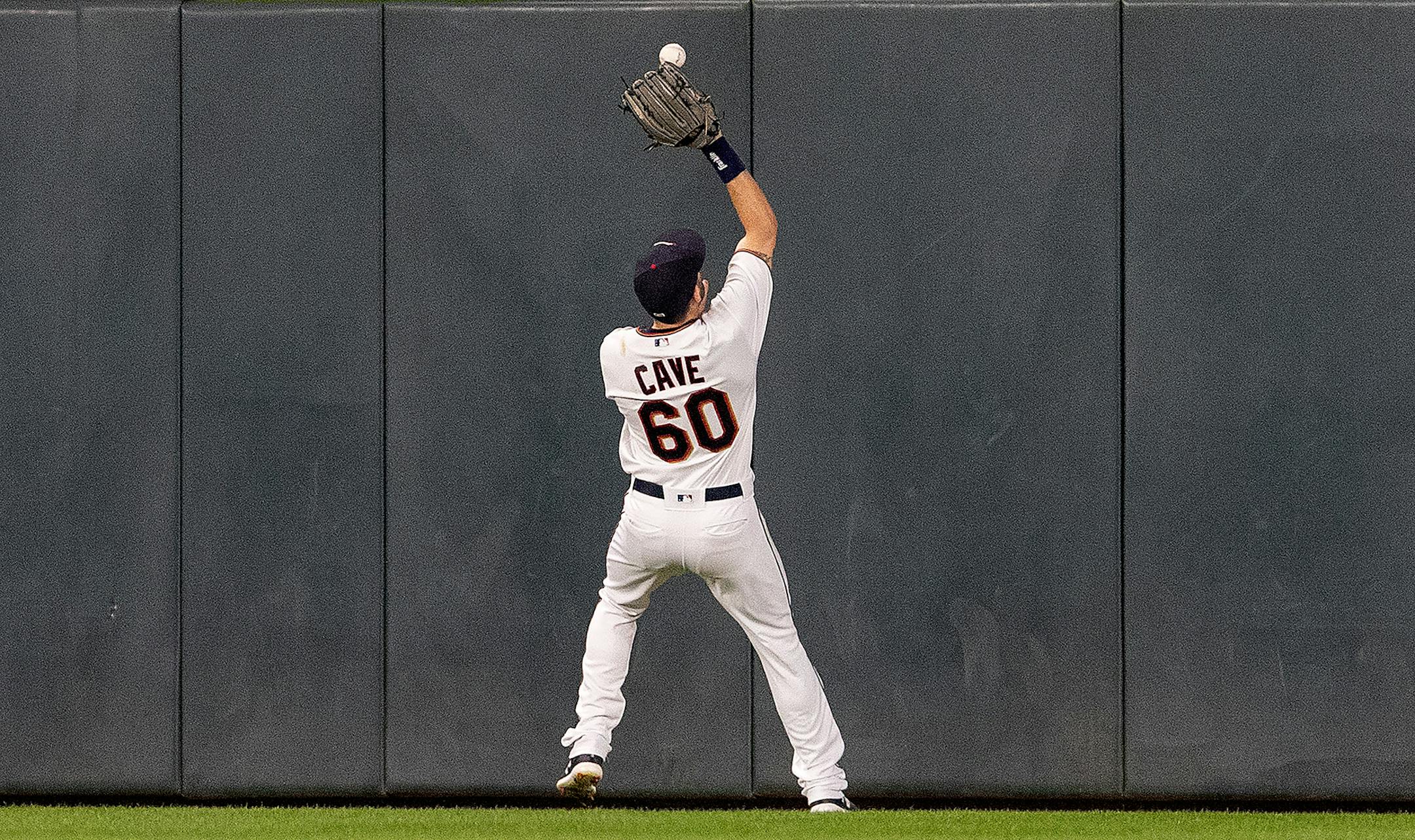 Twins centerfielder Jake Cave fielded a ball hit by Giancarlo Stanton in the seventh inning.