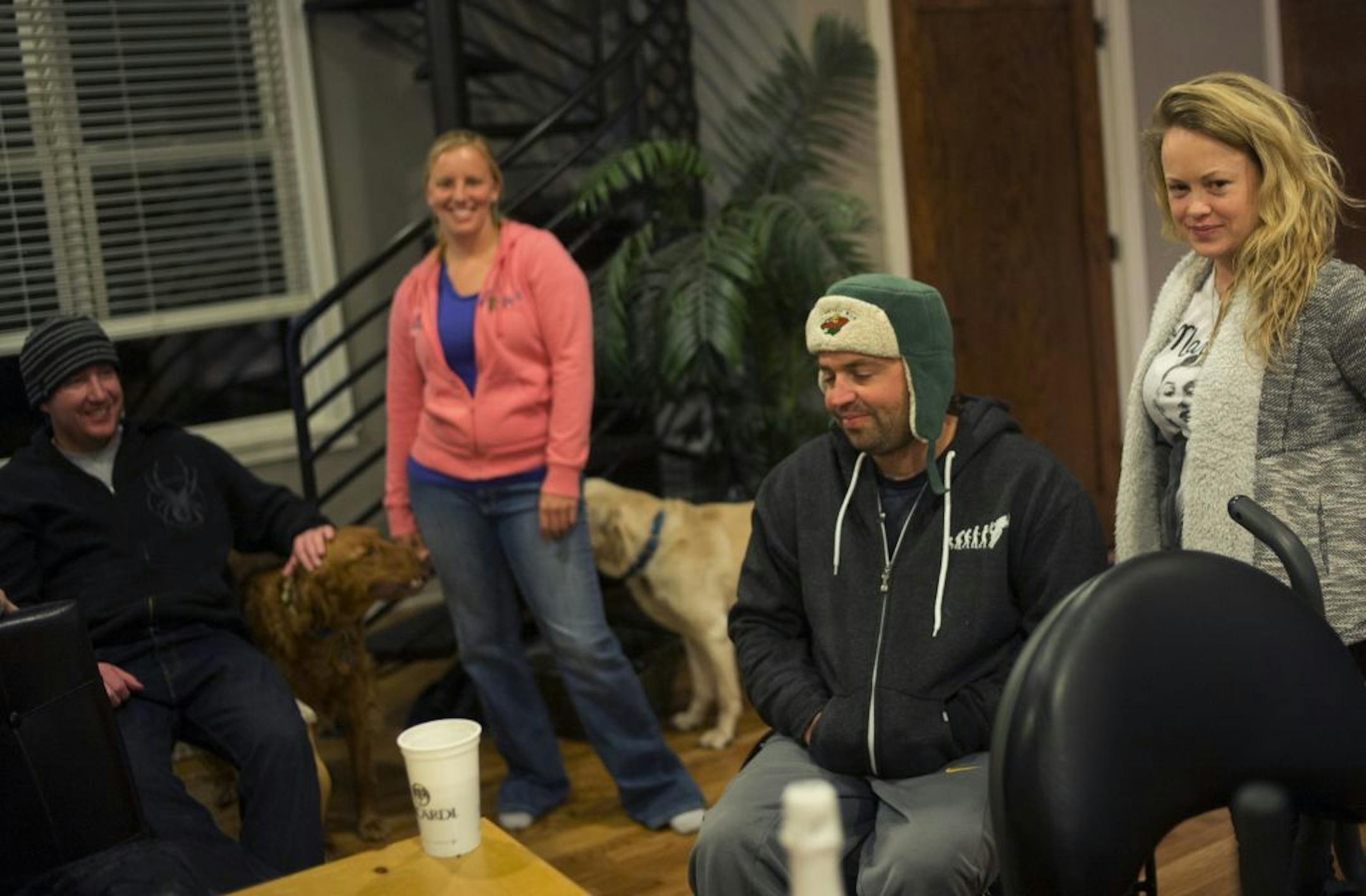 At his home in Wayzata, Ryan Neslund, second from right, from Kate Karlverg, far right, lived to tell about surviving his truck plunging through the ice. He swam to the surface only to cling to dear life on the ice for forty minutes before being rescued on Lake Minnetonka