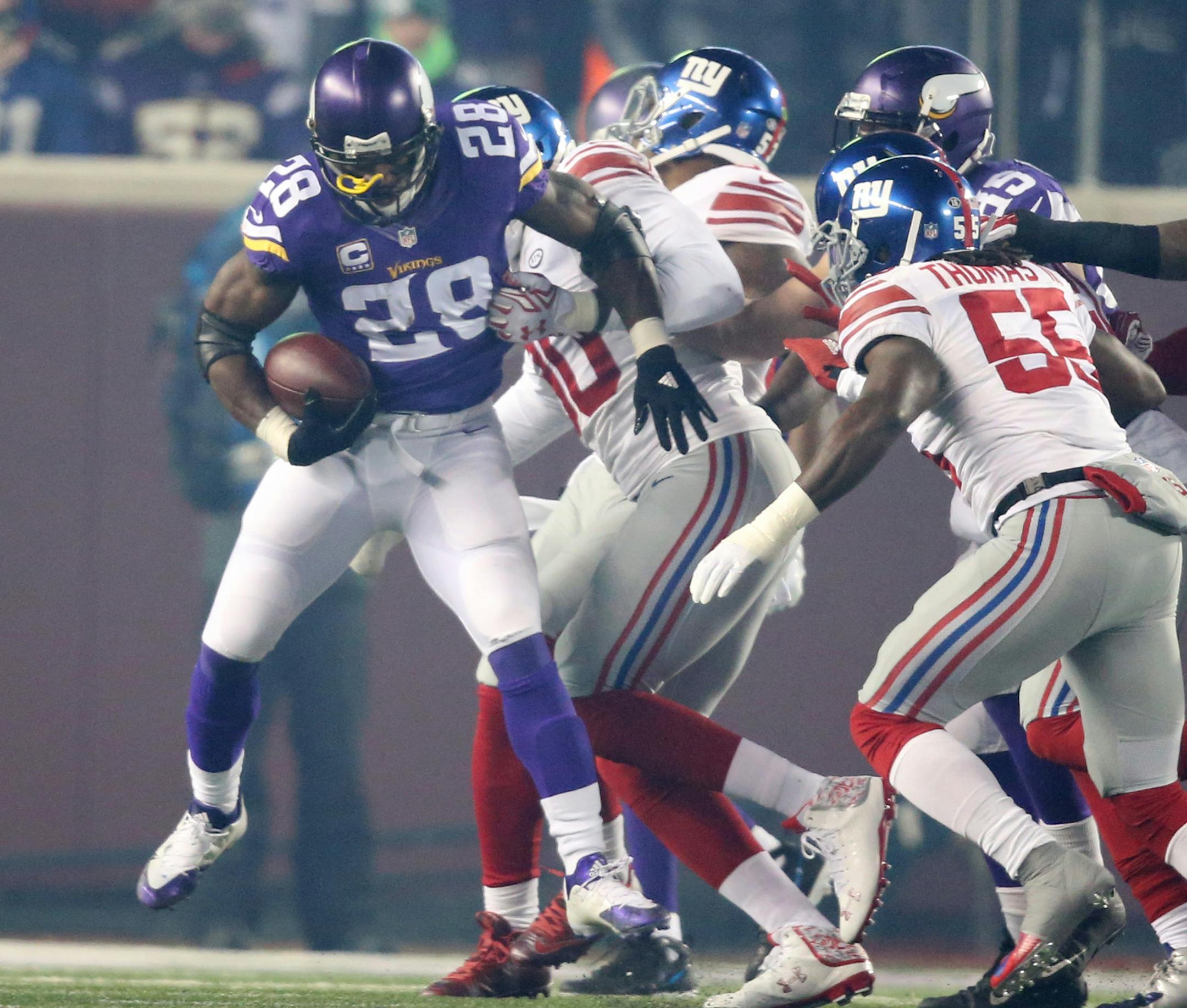 Minnesota Vikings running back Adrian Peterson (28) is stopped for no gain by the Giants defense in the first quarter Sunday December 27, 2015 in Minneapolis, MN. ] The Minnesota Vikings hosted the New York Giants at TCF Bank Stadium. Jerry Holt/ Jerry.Holt@Startribune.com