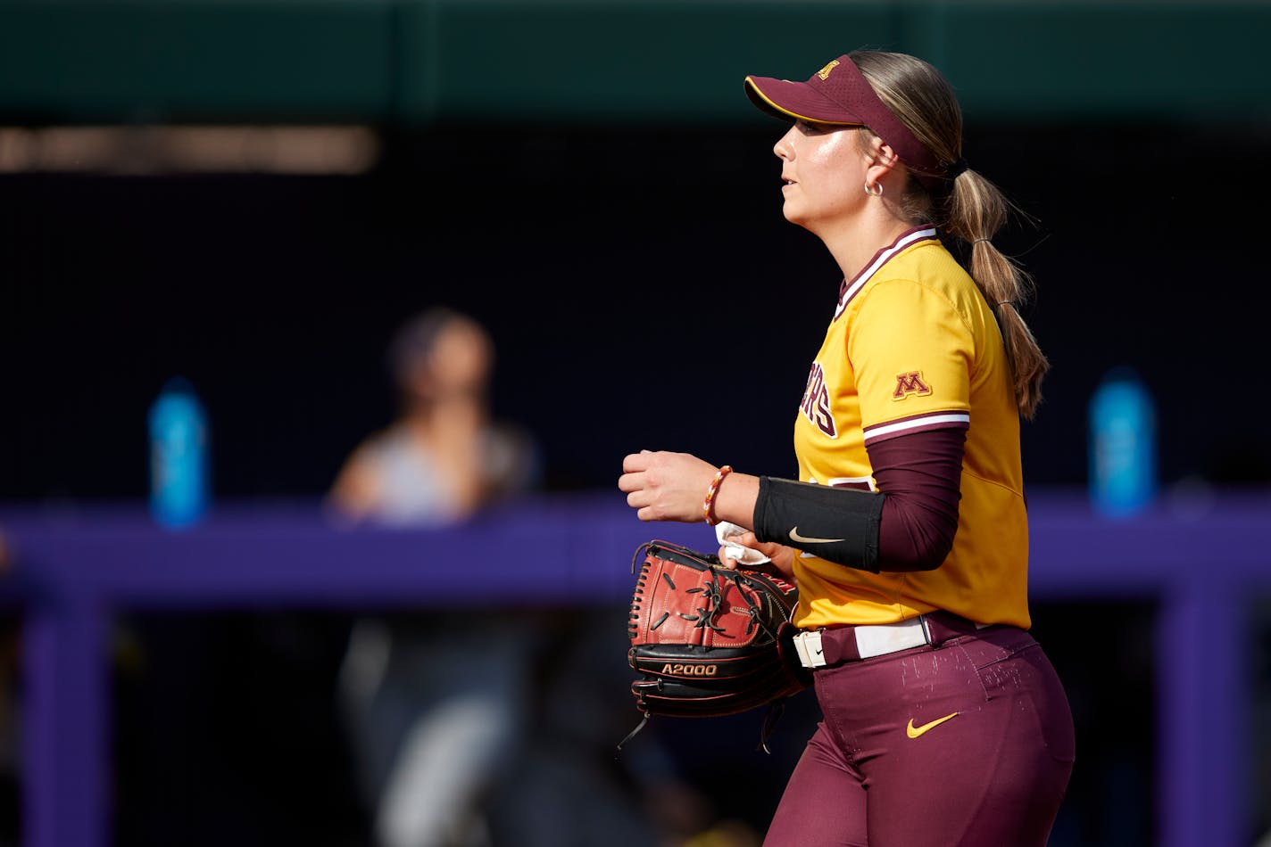 Minnesota starting pitcher Autumn Pease walked off the field after completing an inning against the Northern Colo. during an NCAA softball game on Saturday, May 20, 2023, in Seattle. Pease threw a one hit game in the 4-0 win over Northern Colorado on Saturday. (AP Photo/John Froschauer)