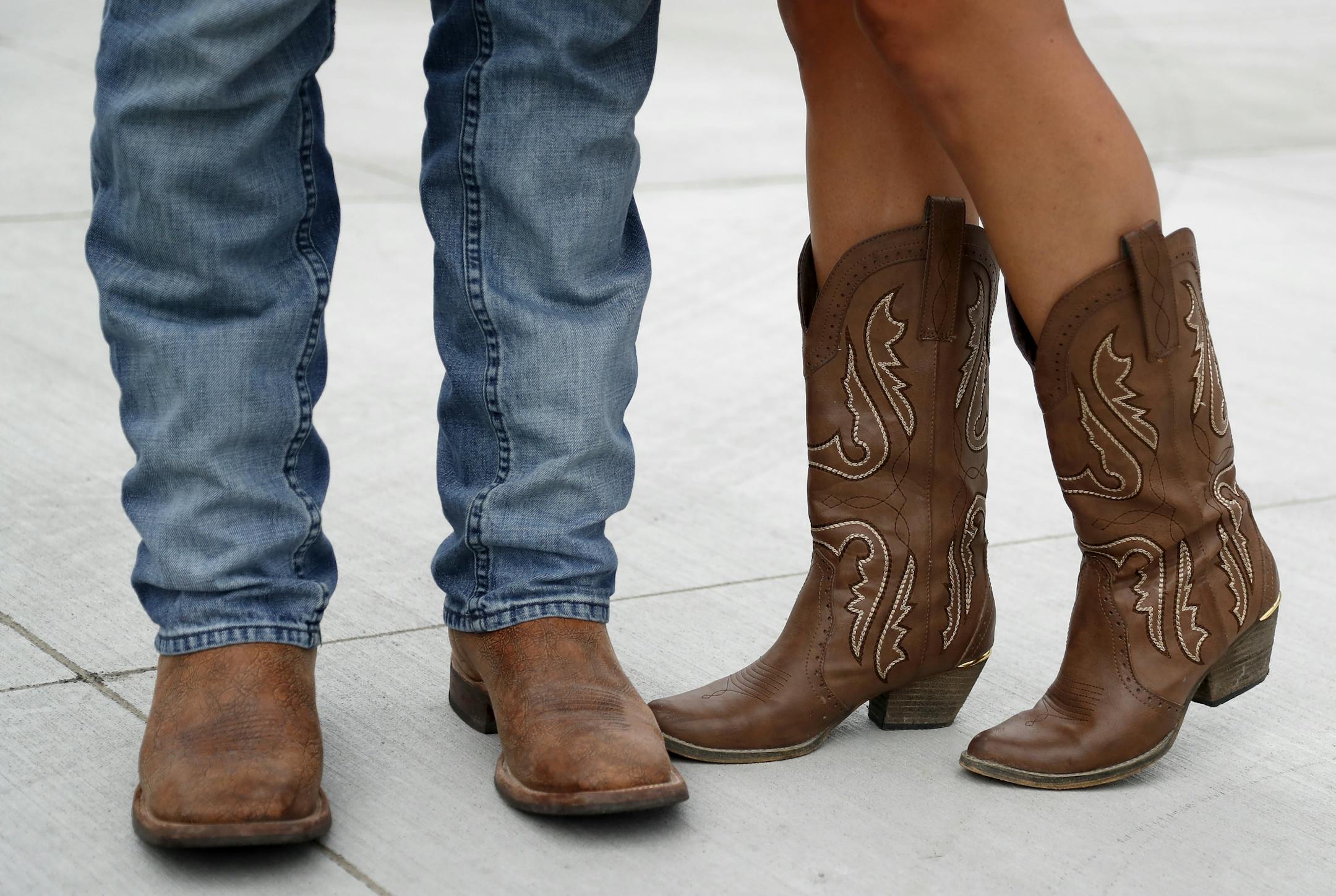 Dave and Lindsay Bauer of Lakeville showed of their boots before entering the Luke Bryan concert at US Bank Stadium.