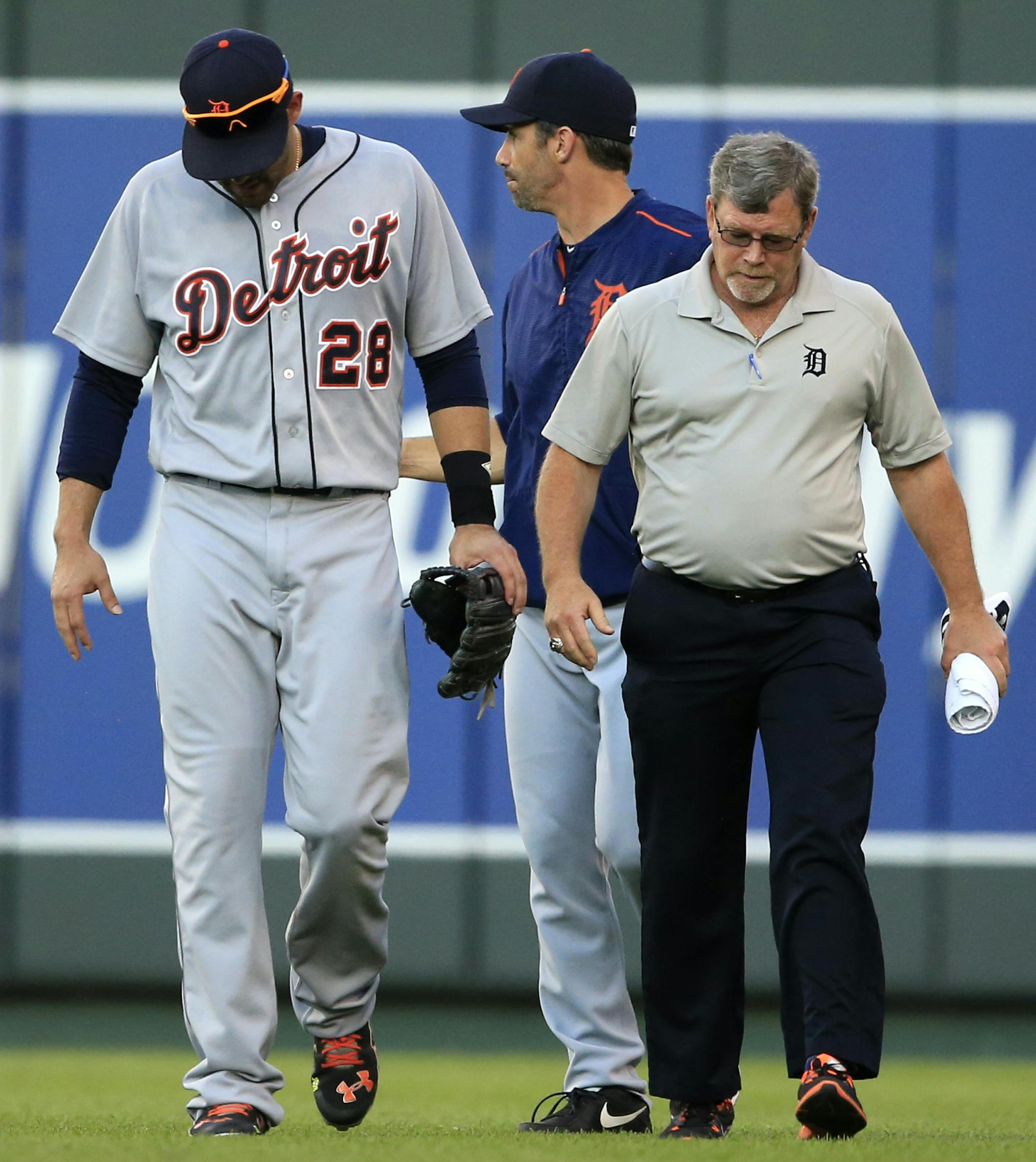 Injured Detroit Tigers right fielder J.D. Martinez (28) leaves the baseball game against the Kansas City Royals during the second inning at Kauffman Stadium in Kansas City, Mo., Thursday, June 16, 2016. (AP Photo/Orlin Wagner)