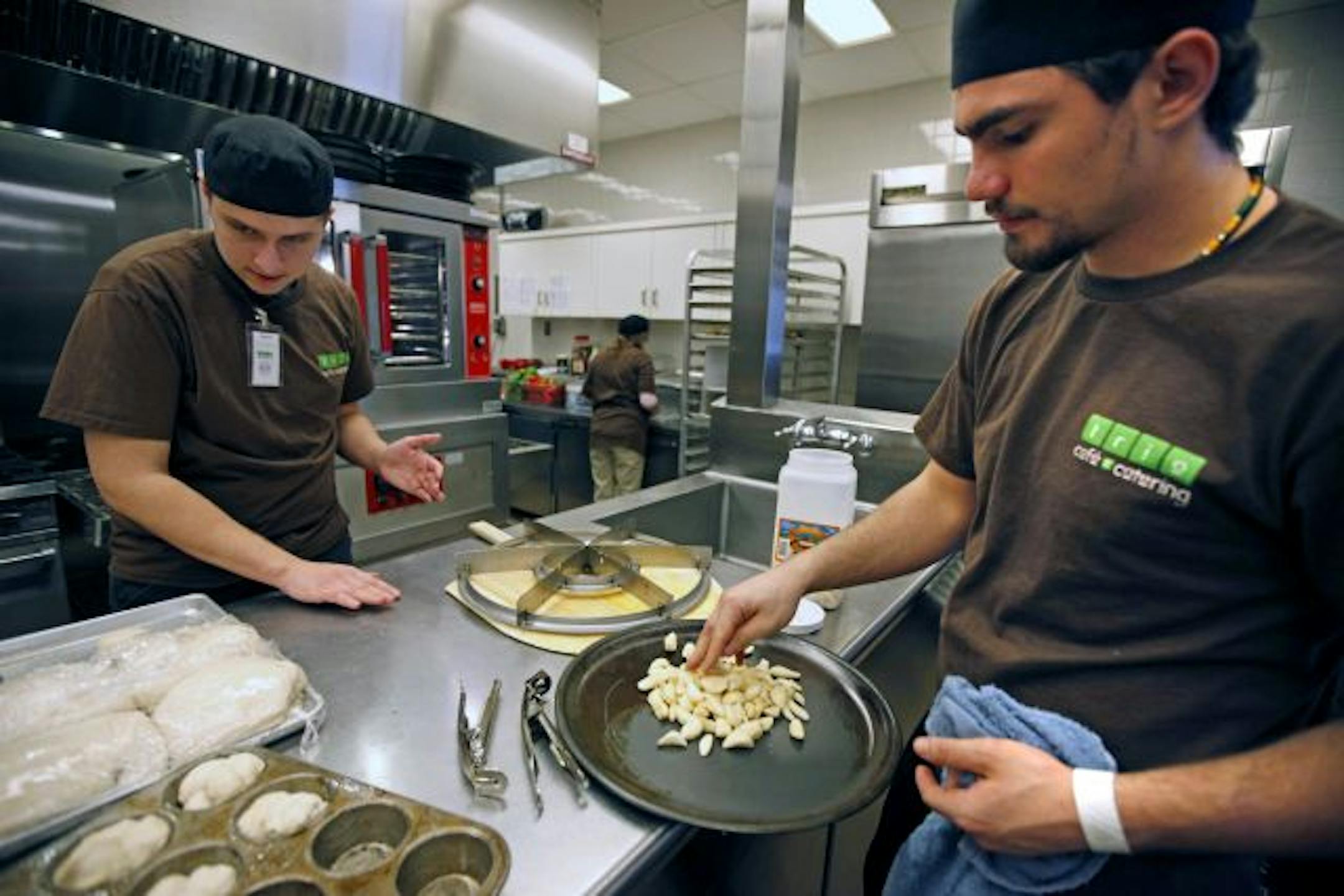 A partnership between Dakota County, School District 197 and the local Green Mill in Hastings has created a new cafeteria at the Judicial Center in Hastings. Students Cory Vinge (left) and Dylon Helsper (right) helped prepare the lunch menu.