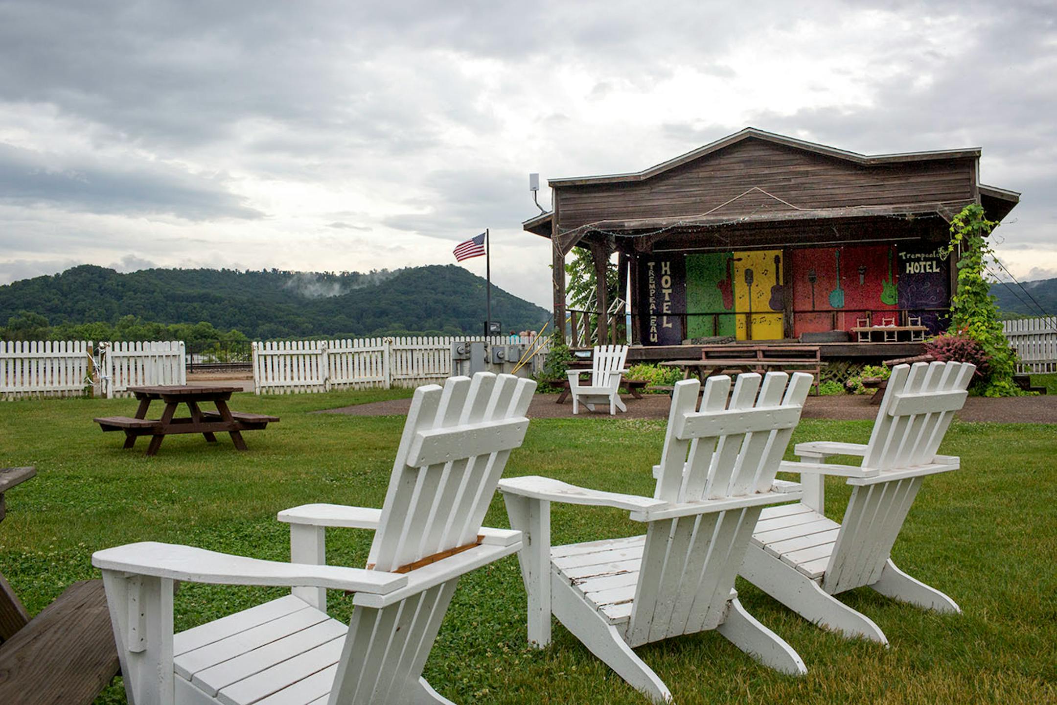 Adirondack chairs look out to the Mississippi River at the Trempealeau Hotel lawn. ] COURTNEY PEDROZA • courtney.pedroza@startribune.com June 22-24, 2017; Wisconsin restaurants, cafes, bars, bakeries and breweries; Dining along the Mississippi River.