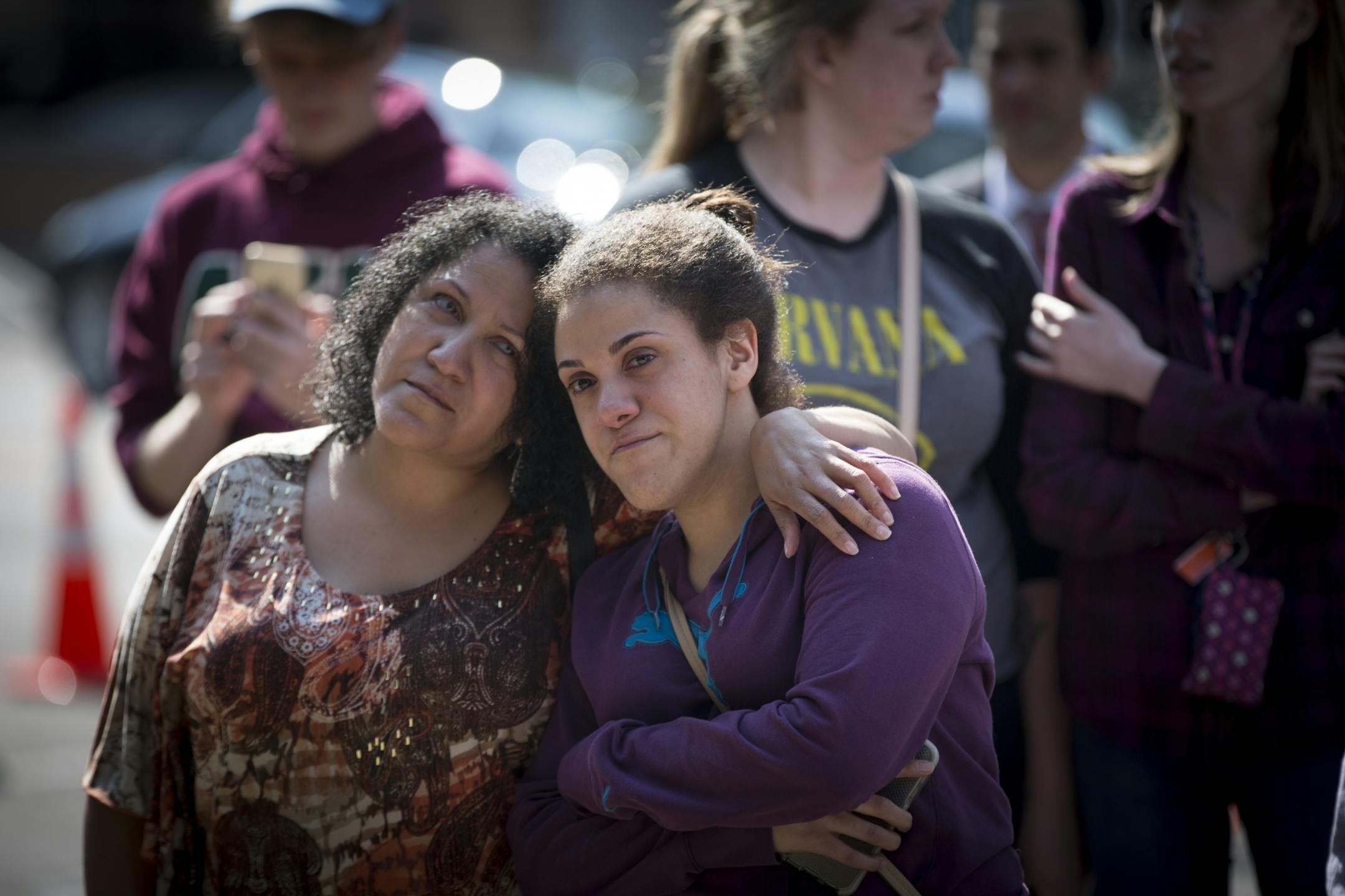 Marisa Kelly comforted her daughter Sarita Kelly, right, as she cried at a memorial set up at Prince's star at First Avenue on Thursday, April 21, 2016. Prince was found dead at his home today at the age of 57.